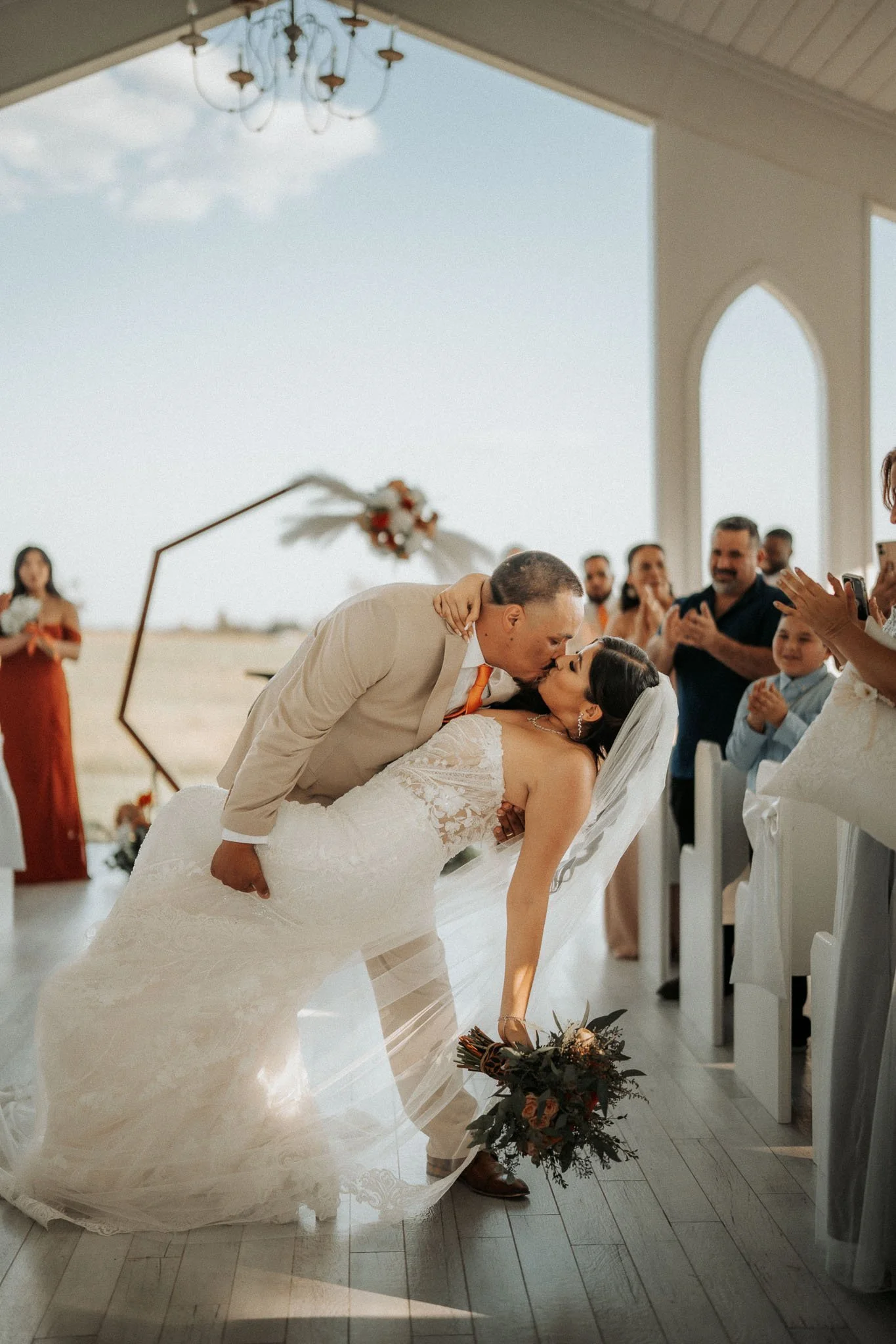 wedding-ceremony-dip-kiss-chandelier-farms.jpg