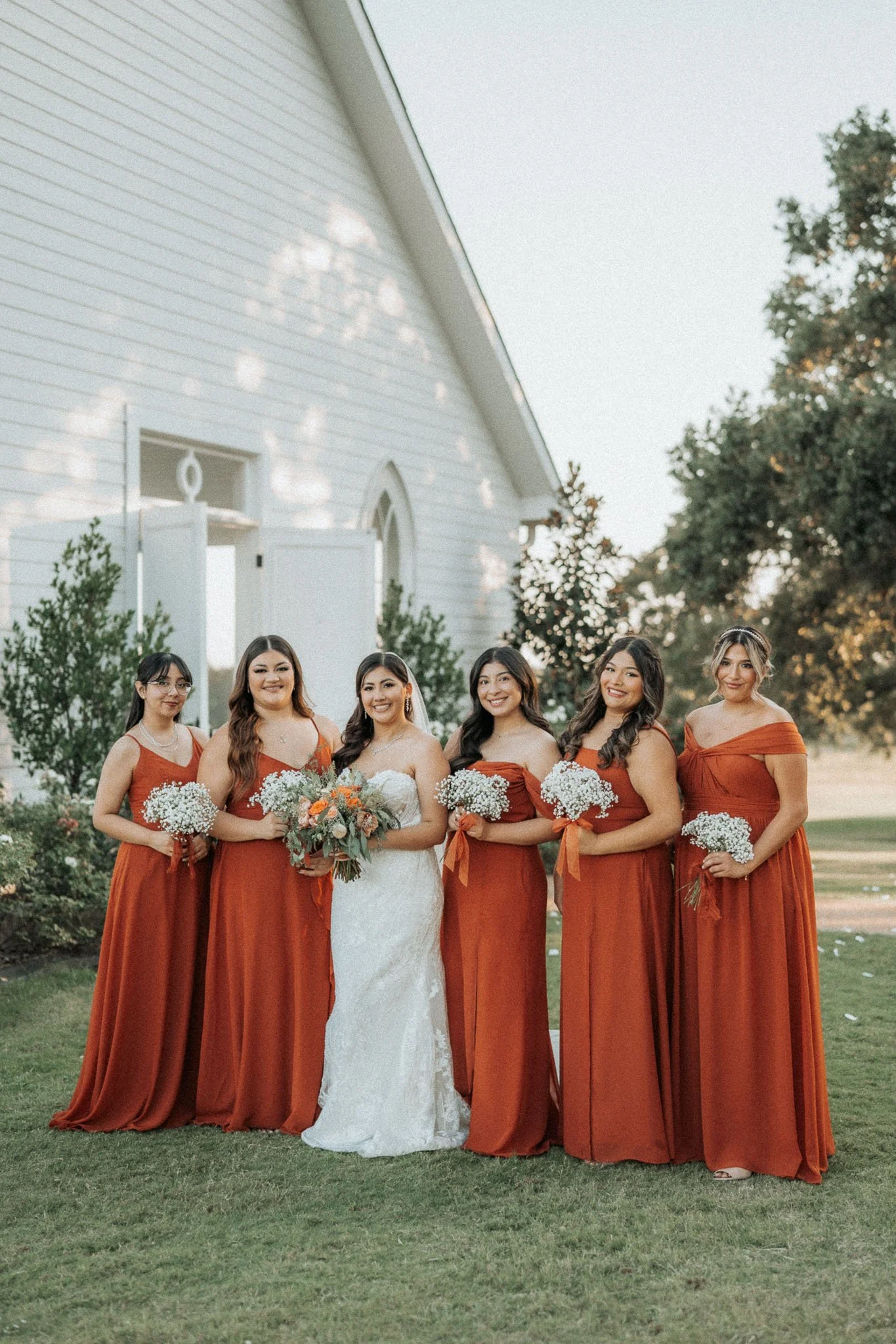 bridesmaids-rust-dresses-wedding-party.jpg