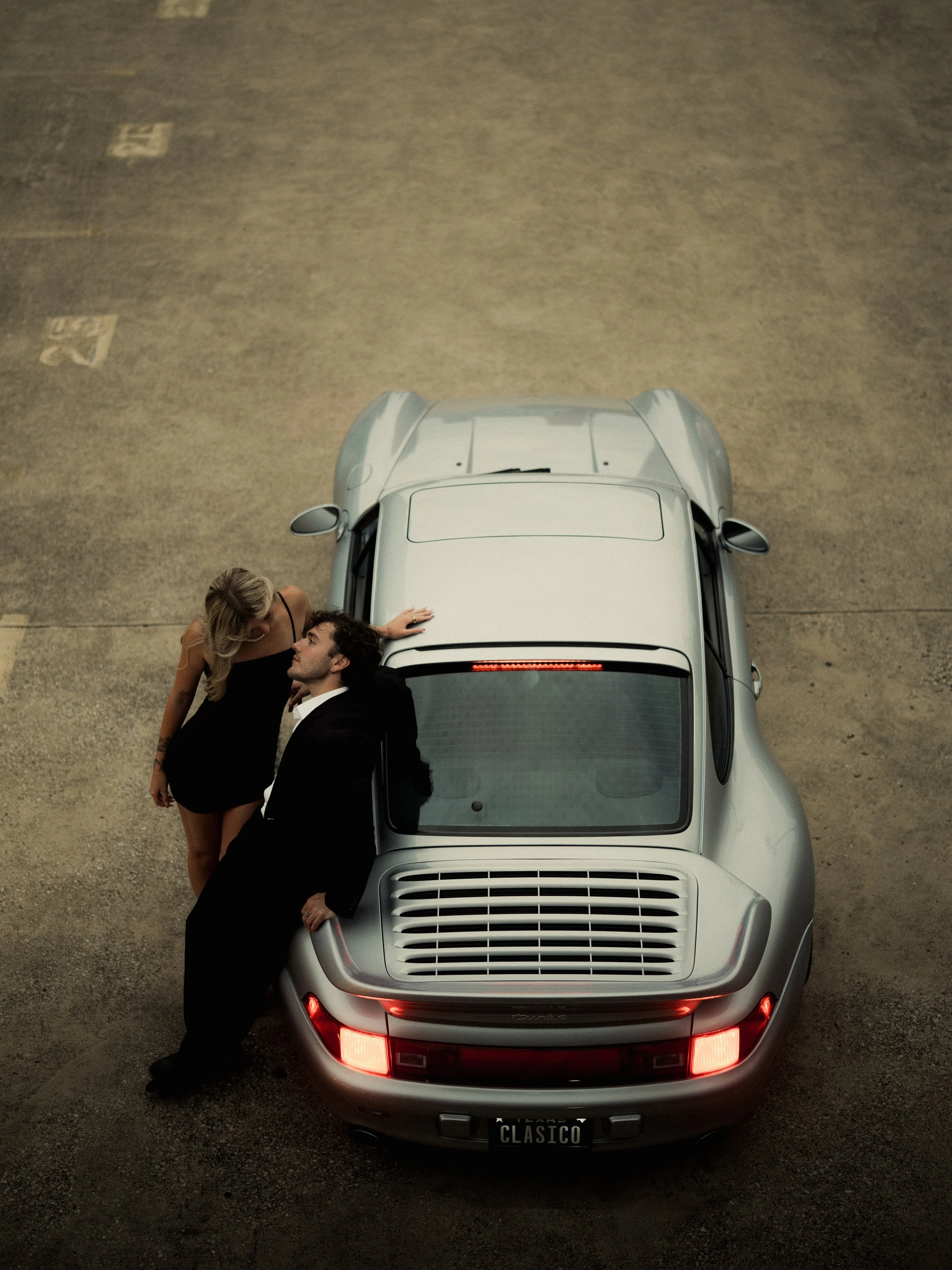 overhead-aerial-shot-couple-silver-classic-porsche.jpg