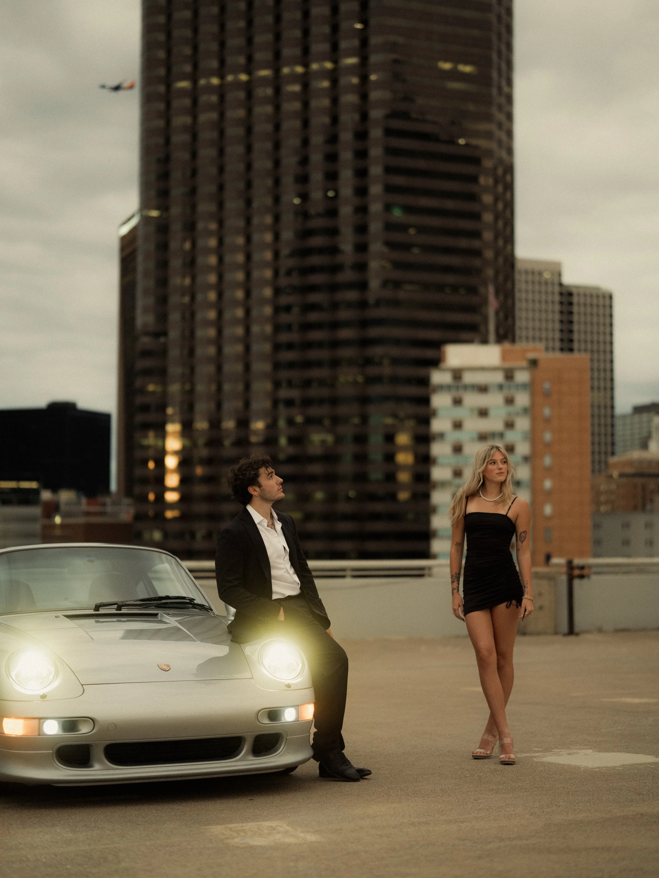 moody-downtown-couples-photoshoot-headlights-porsche.jpg