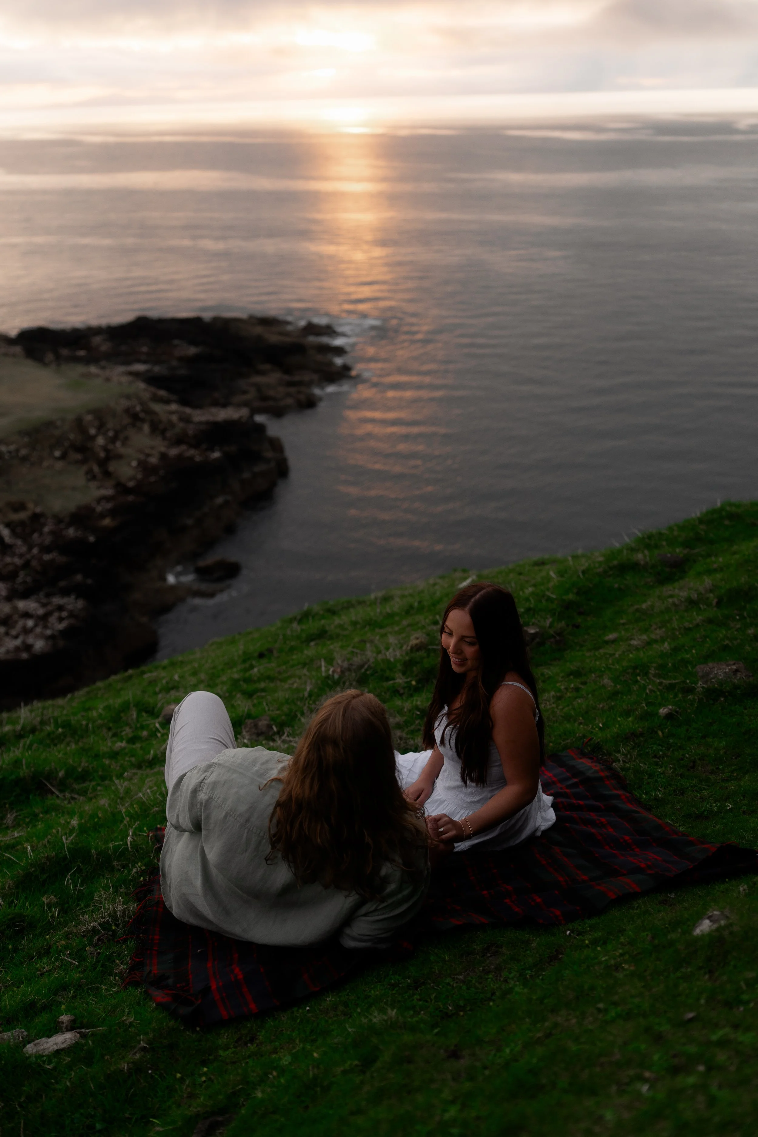couple-sitting-cliffside-blanket-isle-of-skye-sunset.jpg