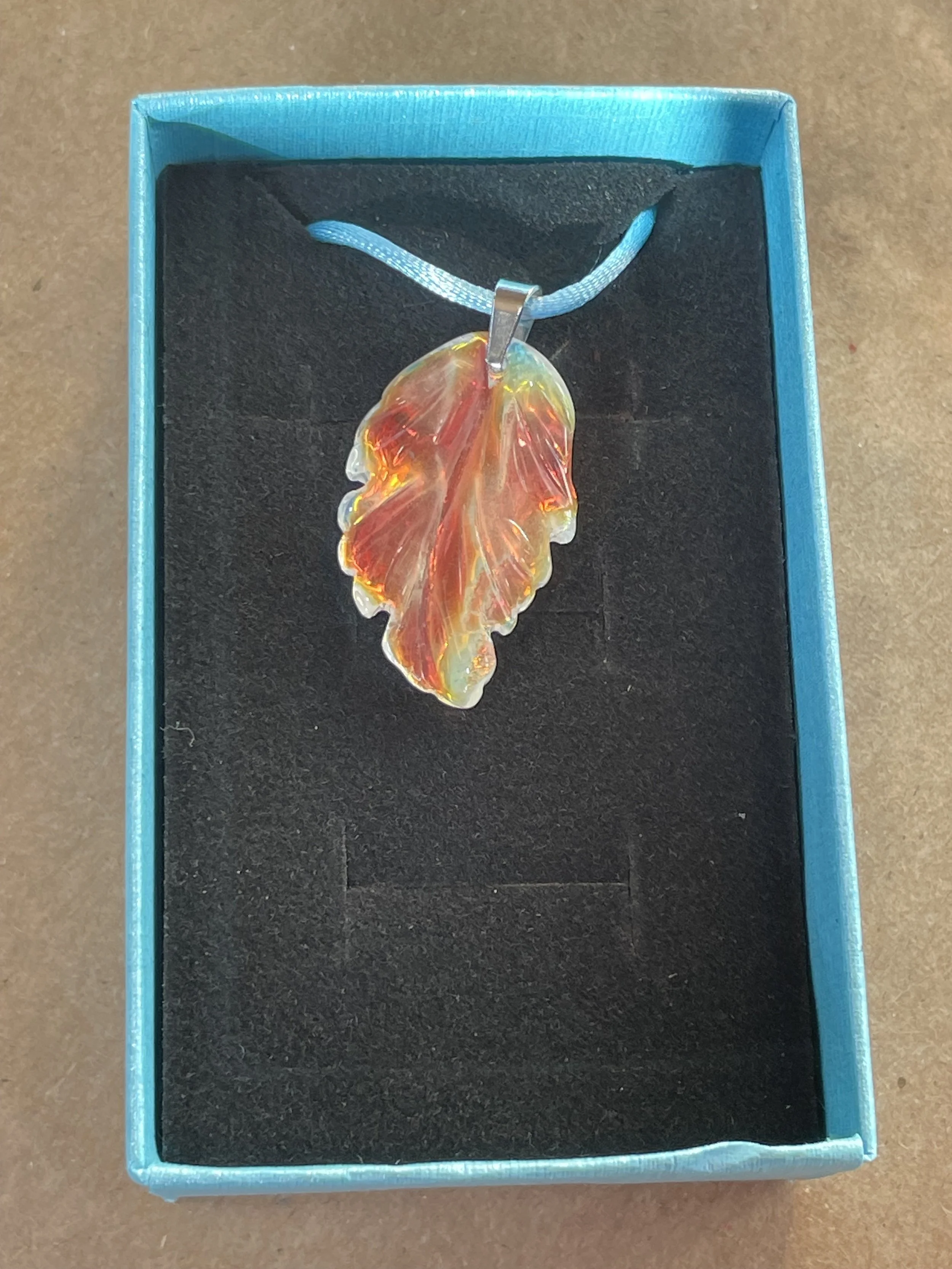 Glass Leaf Pendant Orange:Pink on Blue Cord.jpg