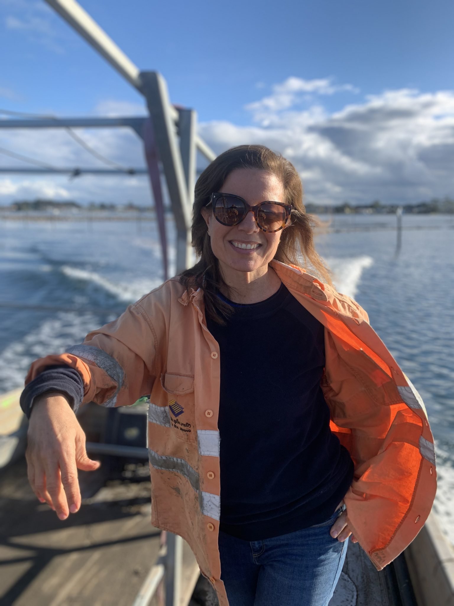 Annabel Williams, co-owner of Bel's Oysters, on the boat crossing the oyster leases at Greenwell Point