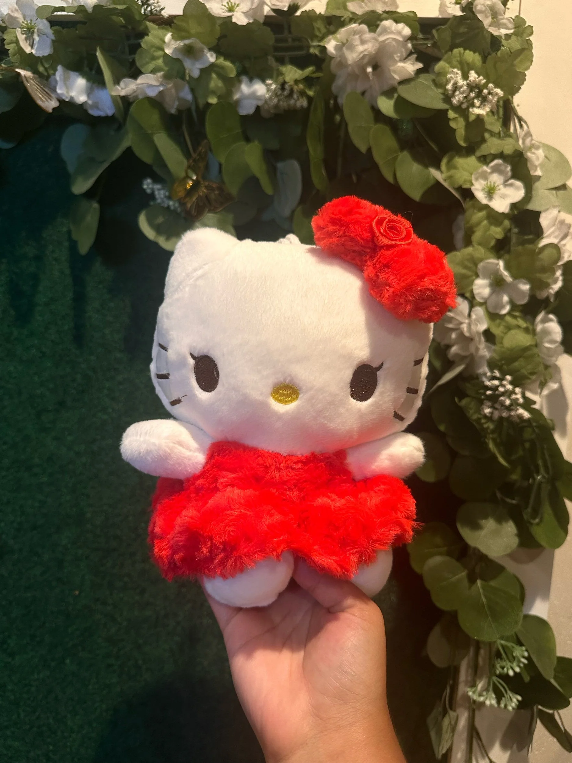 Red dress Hello Kitty plush toy.