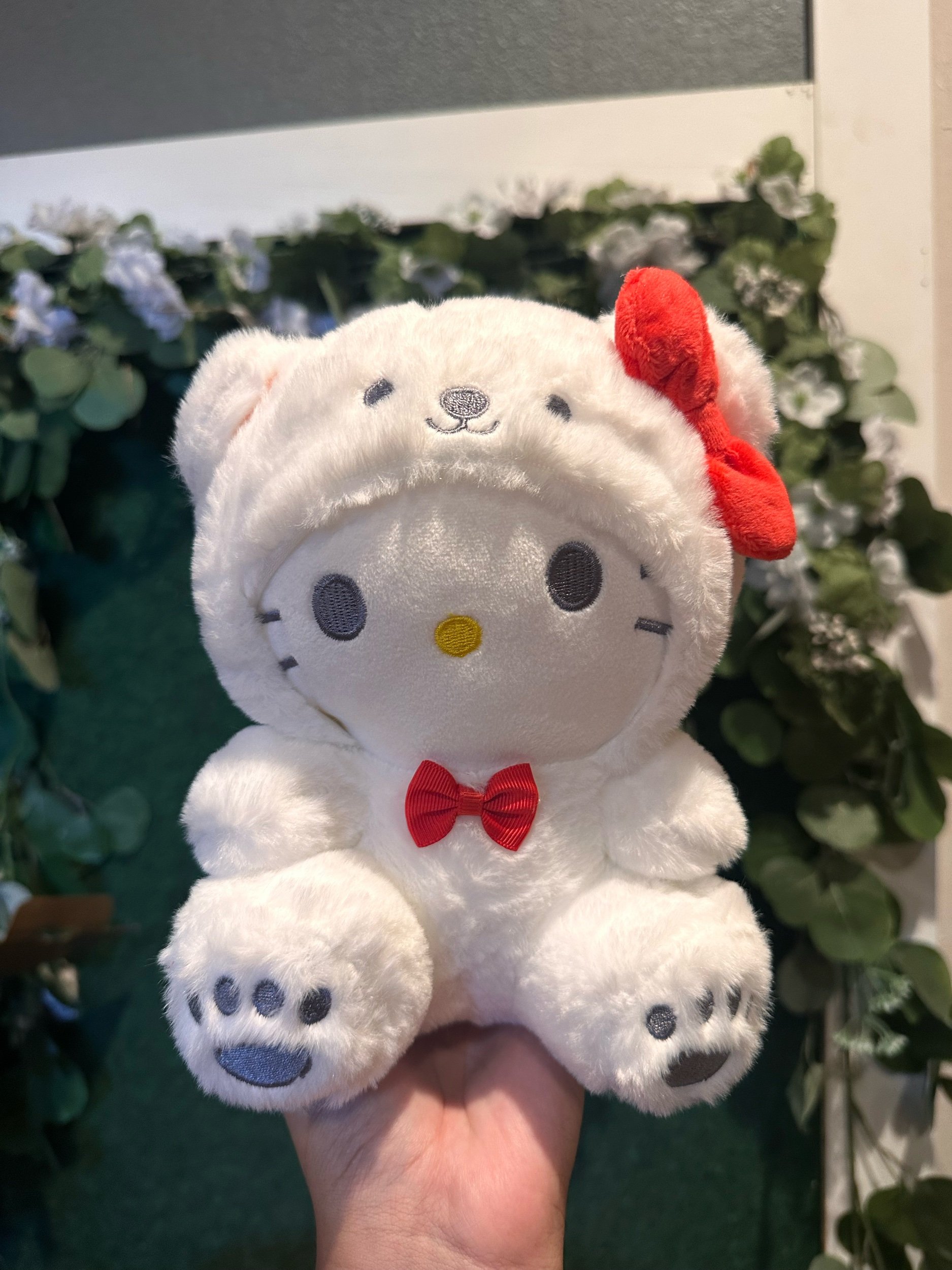 Snowy Hello Kitty plush toy.