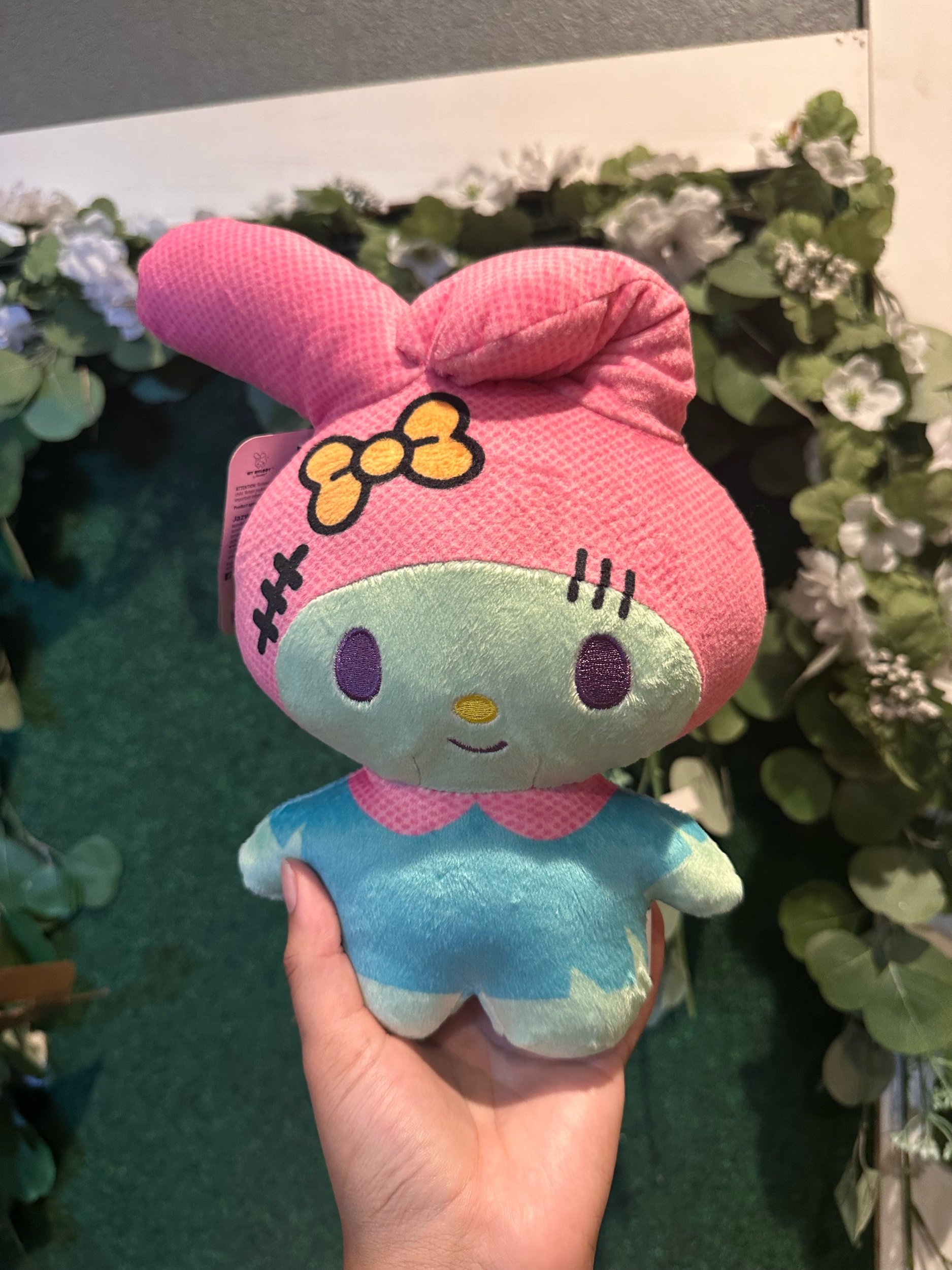 My Melody plush dressed in a zombie-themed costume.