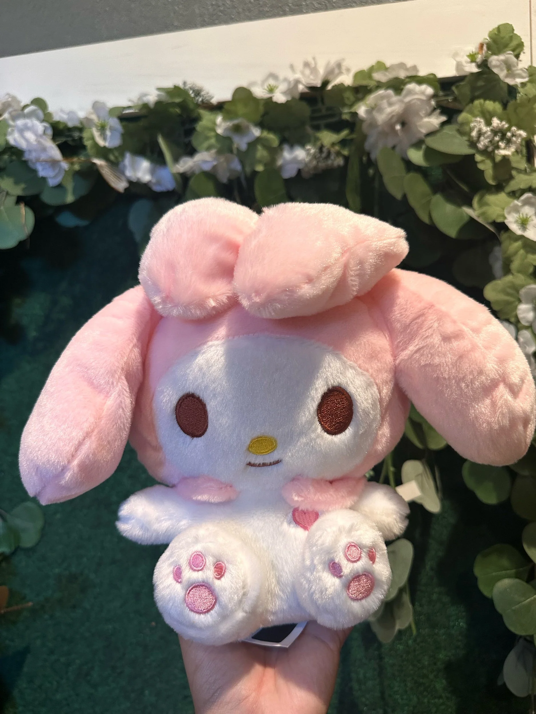 Pink My Melody plush toy with long bunny ears and signature hood.