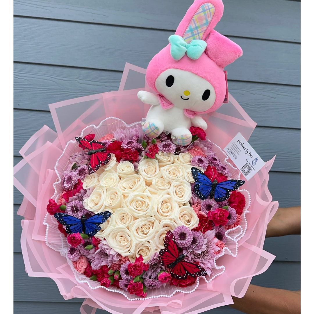 Pink, purple, and white floral bouquet with My Melody plush and butterfly accents