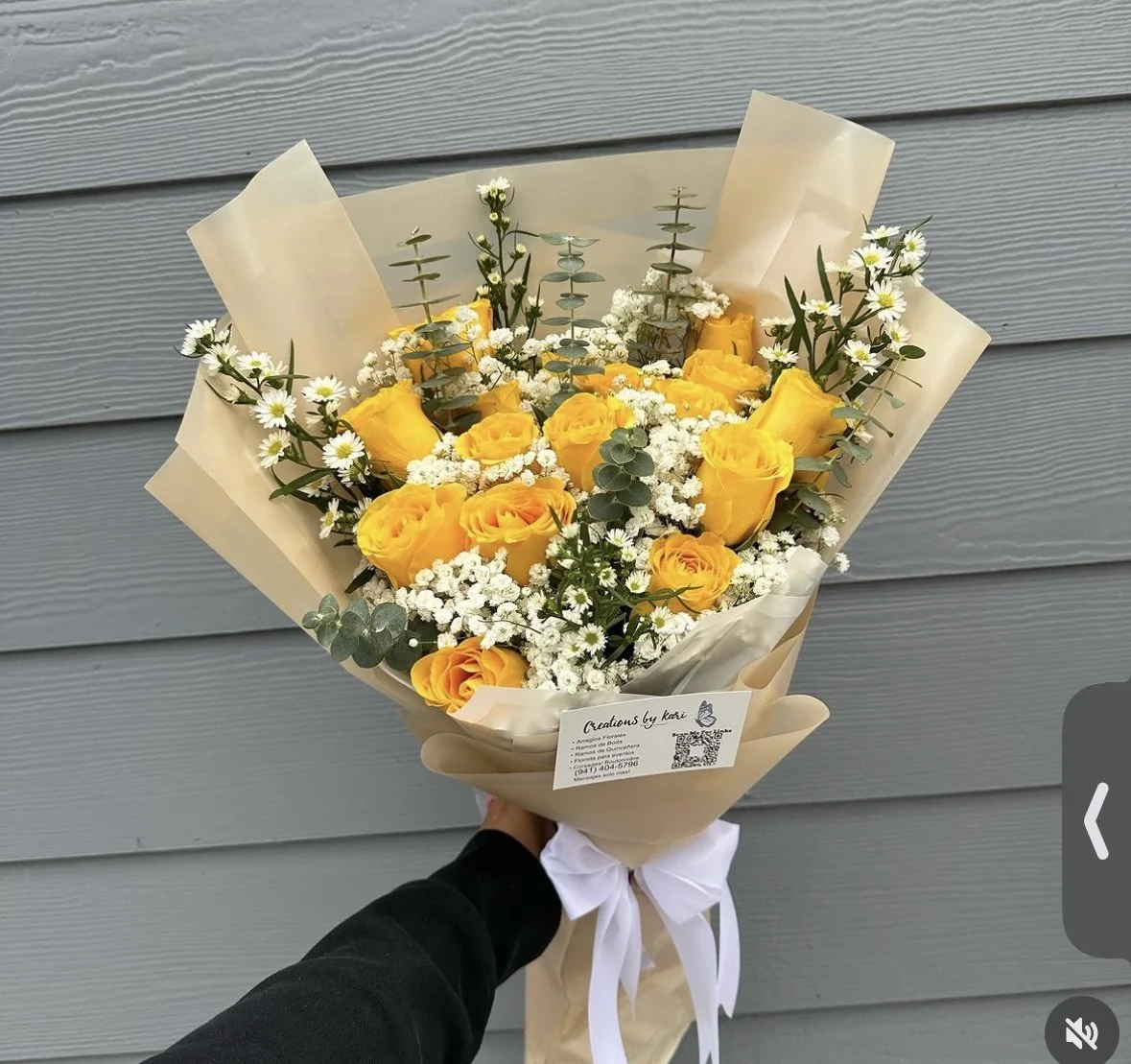 Yellow rose and white daisy bouquet wrapped in beige floral paper