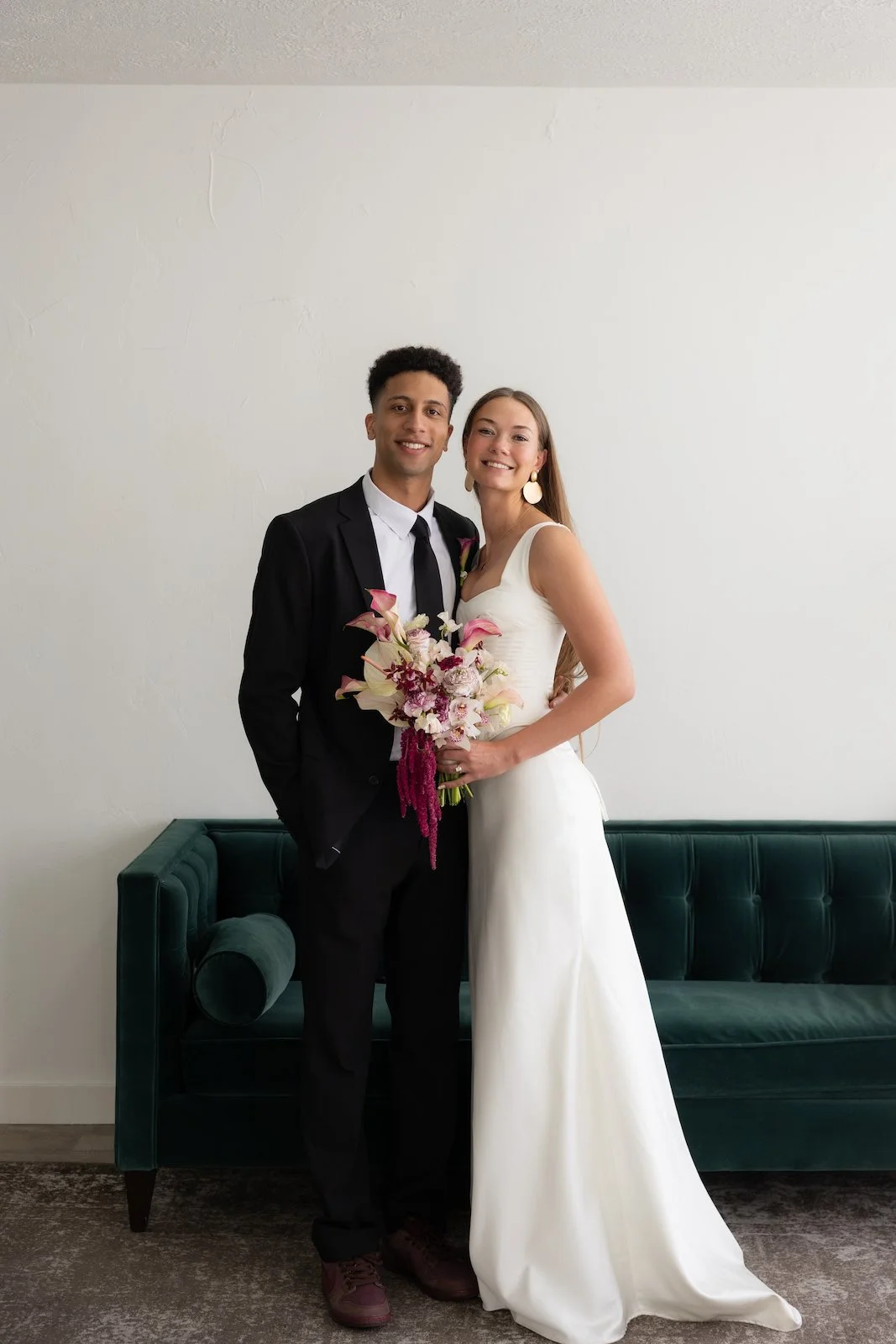bride-groom-portrait-velvet-couch-the-ivory-hall-provo-utah.jpg