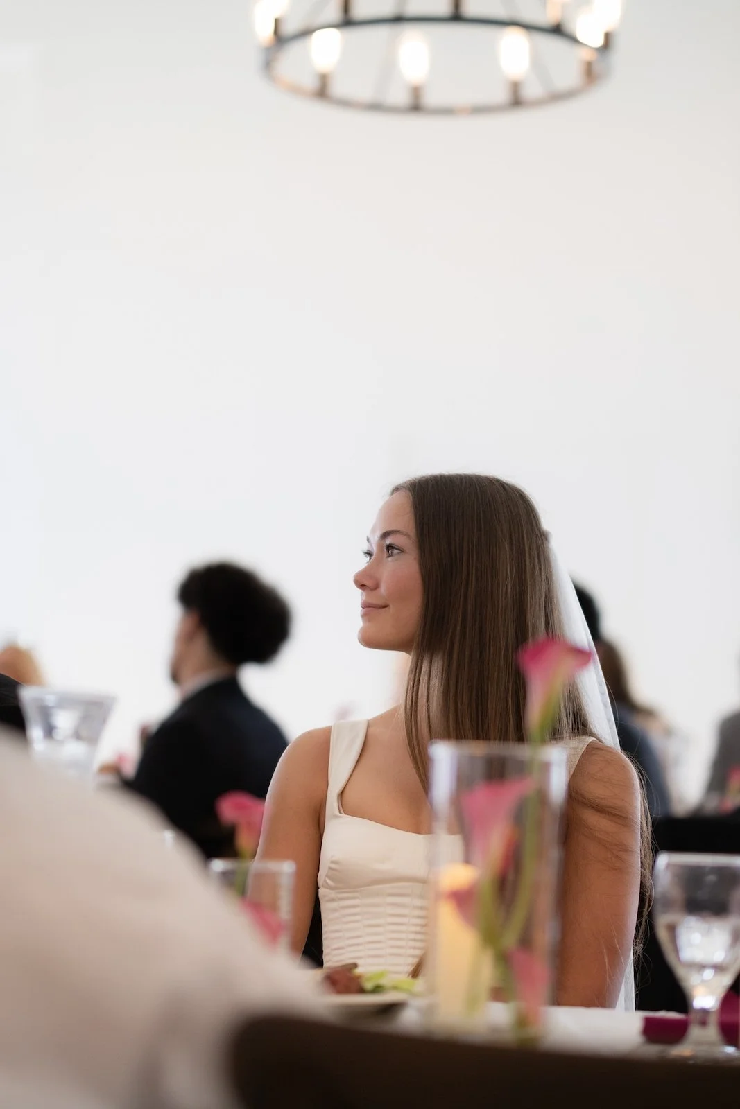 bride-seated-luncheon-chandelier-the-ivory-hall-provo-utah.jpg