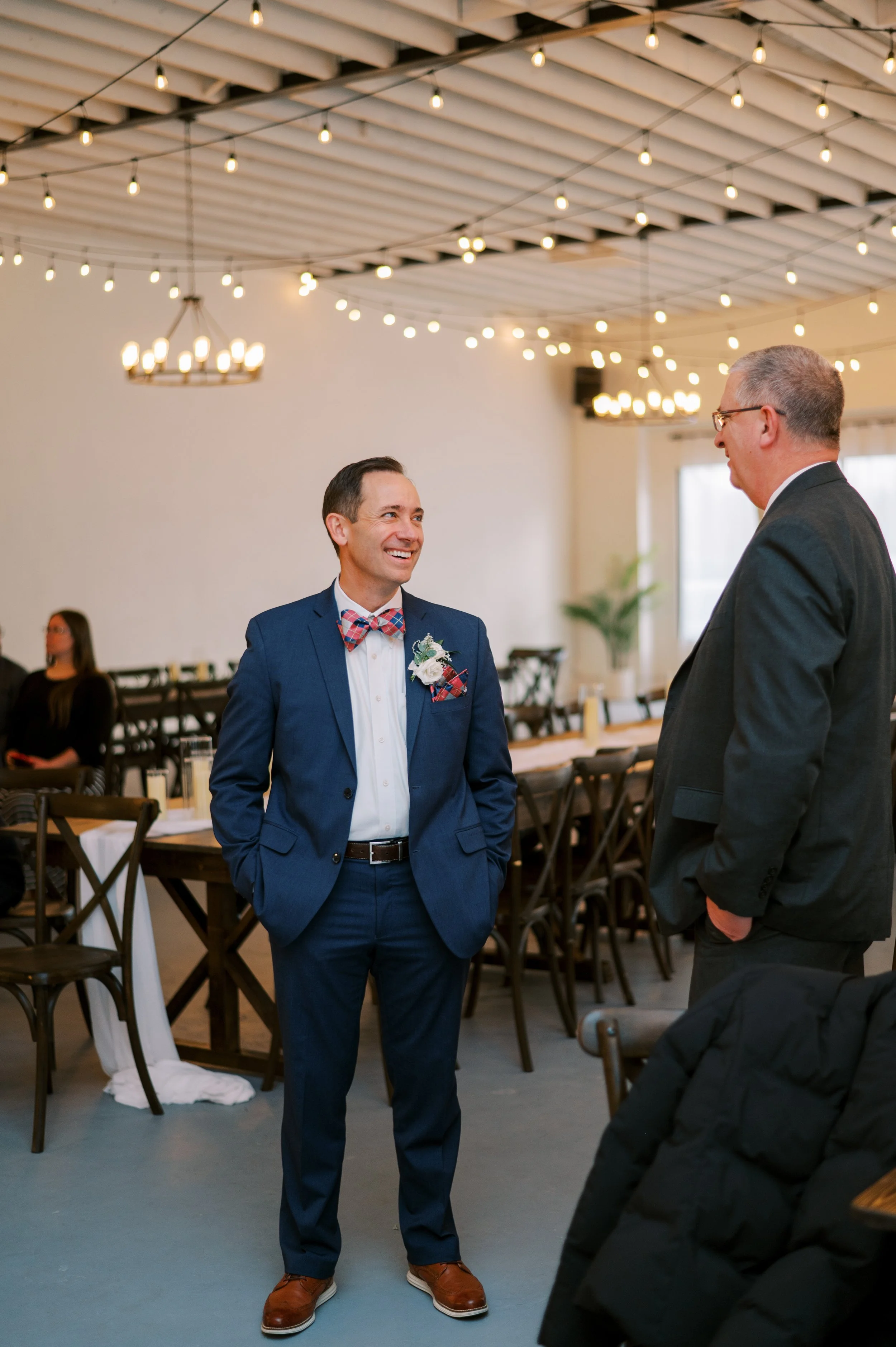 Guests warmly greet each other in The Ivory Hall’s reception area, highlighting the venue’s inviting atmosphere and spacious layout for mingling and conversation.