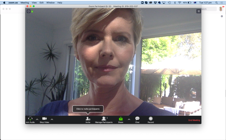 Video call example showing overhead lighting creating shadows on a professional’s face during a Zoom meeting.