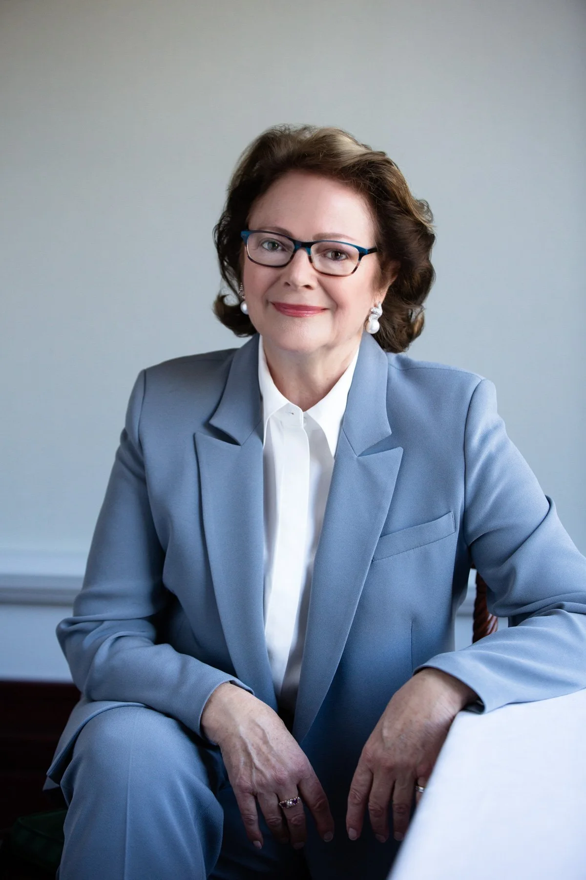 Professional corporate headshot of a business professional, showcasing a polished and approachable image for LinkedIn and professional branding.