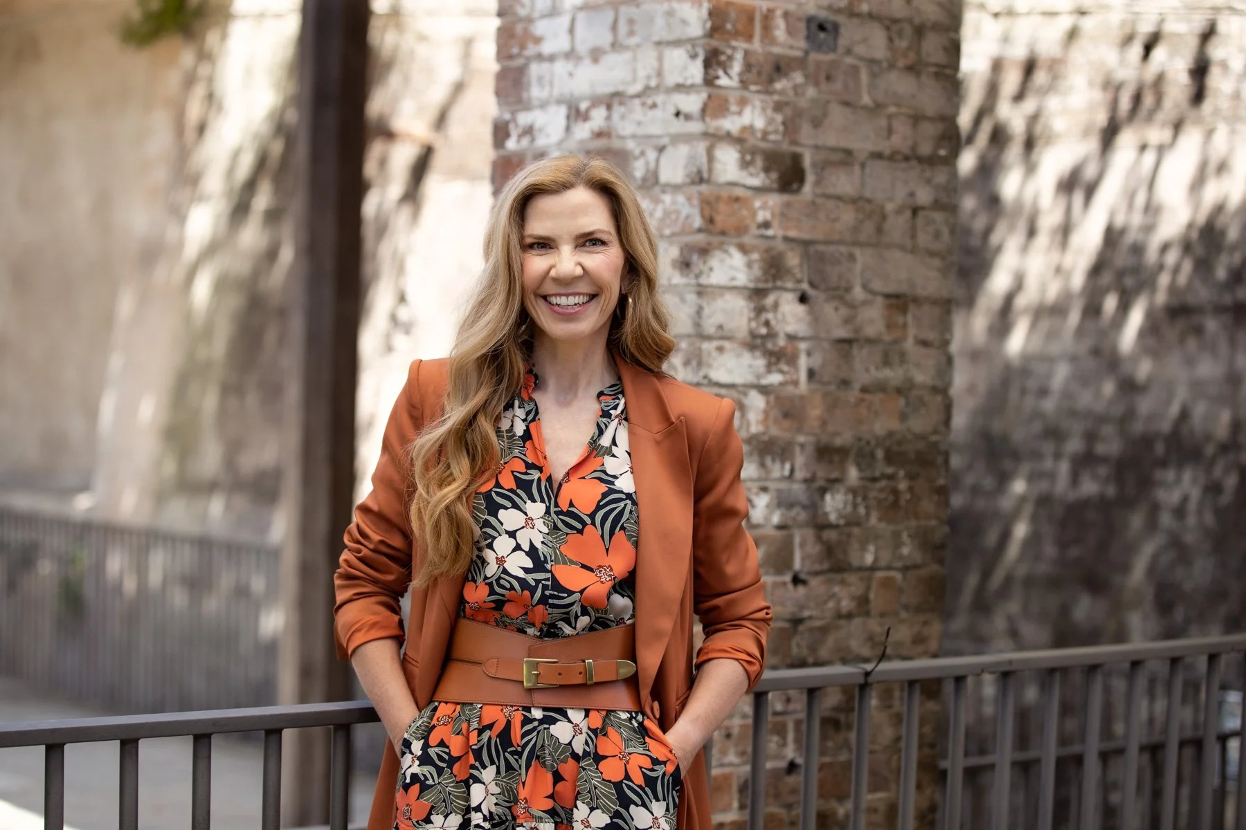 Woman in floral professional outfit pose for Personal Branding shoot