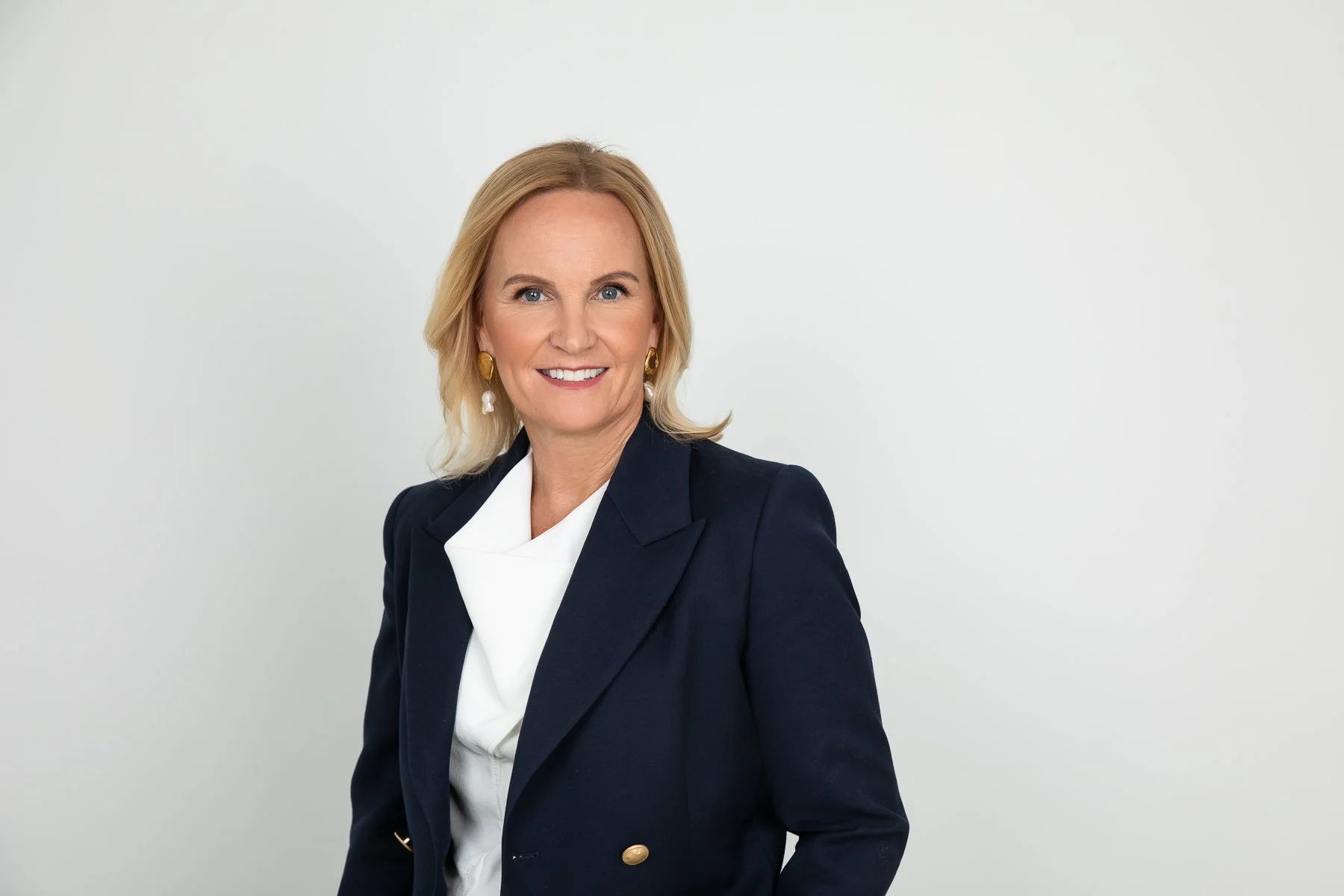 Professional corporate headshot showcasing a solid-colour outfit suitable for a polished business portrait in Sydney.