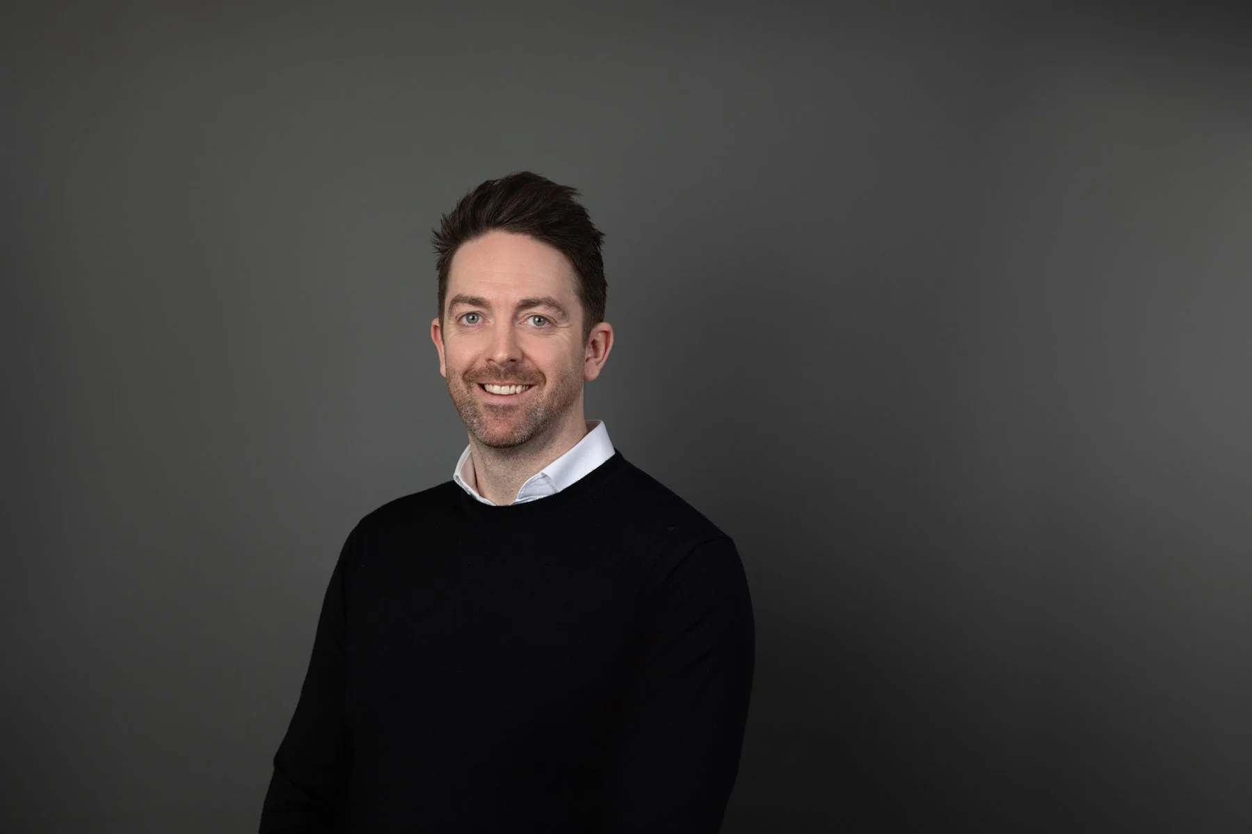 Professional corporate portrait demonstrating a polished neckline and business attire for a Sydney headshot session.