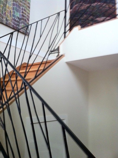 Wrought iron balustrade Sticks going up stairs by artist and blacksmith David Wood.