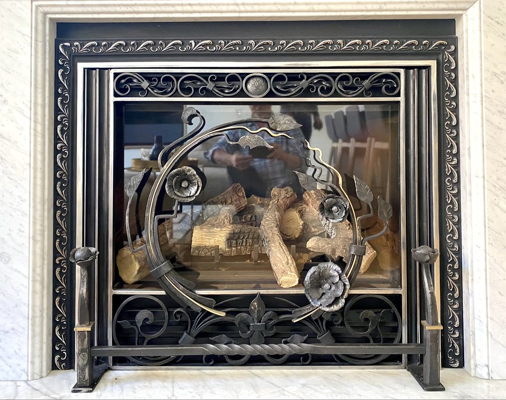 Wrought iron fireplace enclosure by artist David Wood.