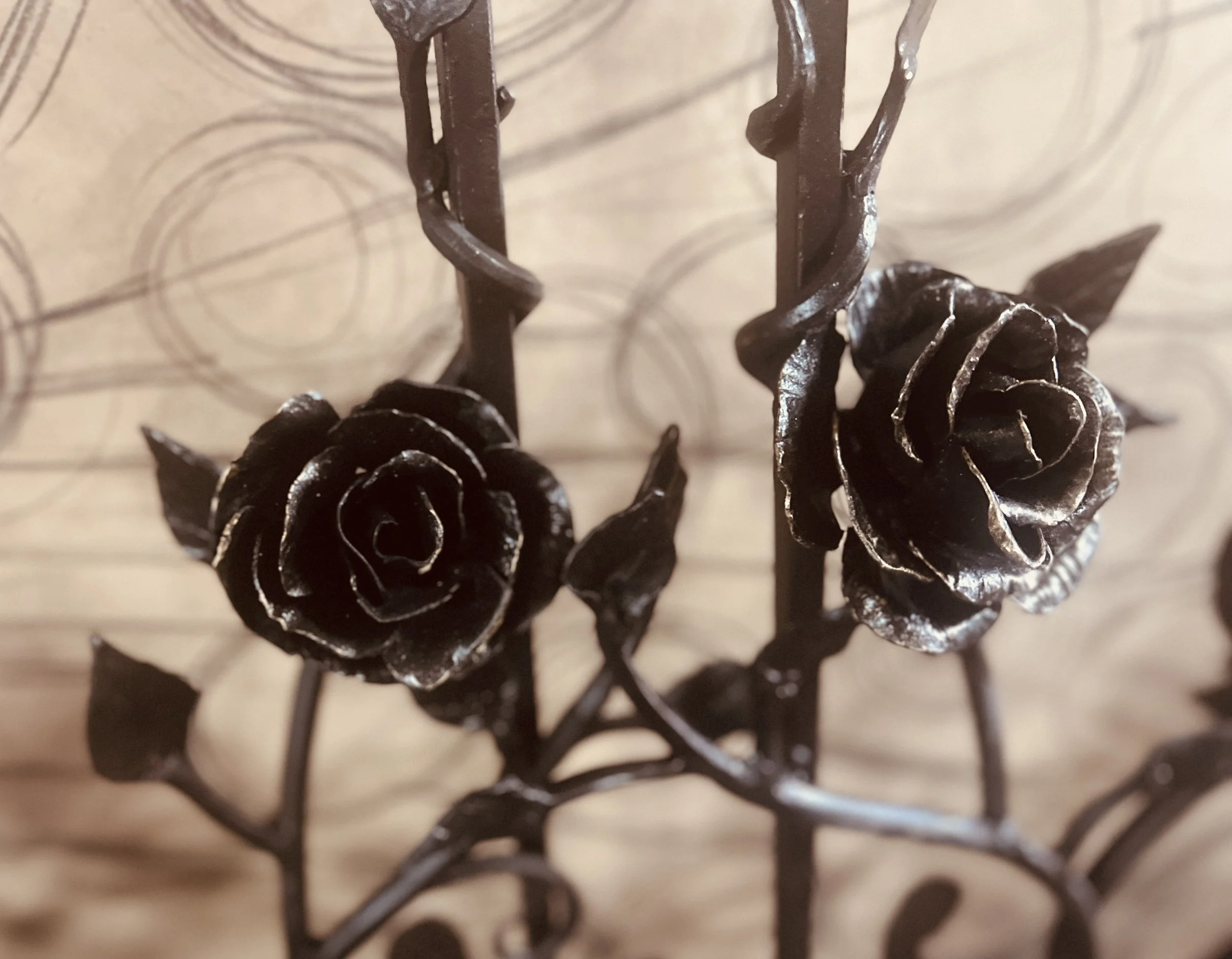 Bent-Metal-Roses-on-Window-Grille.JPG