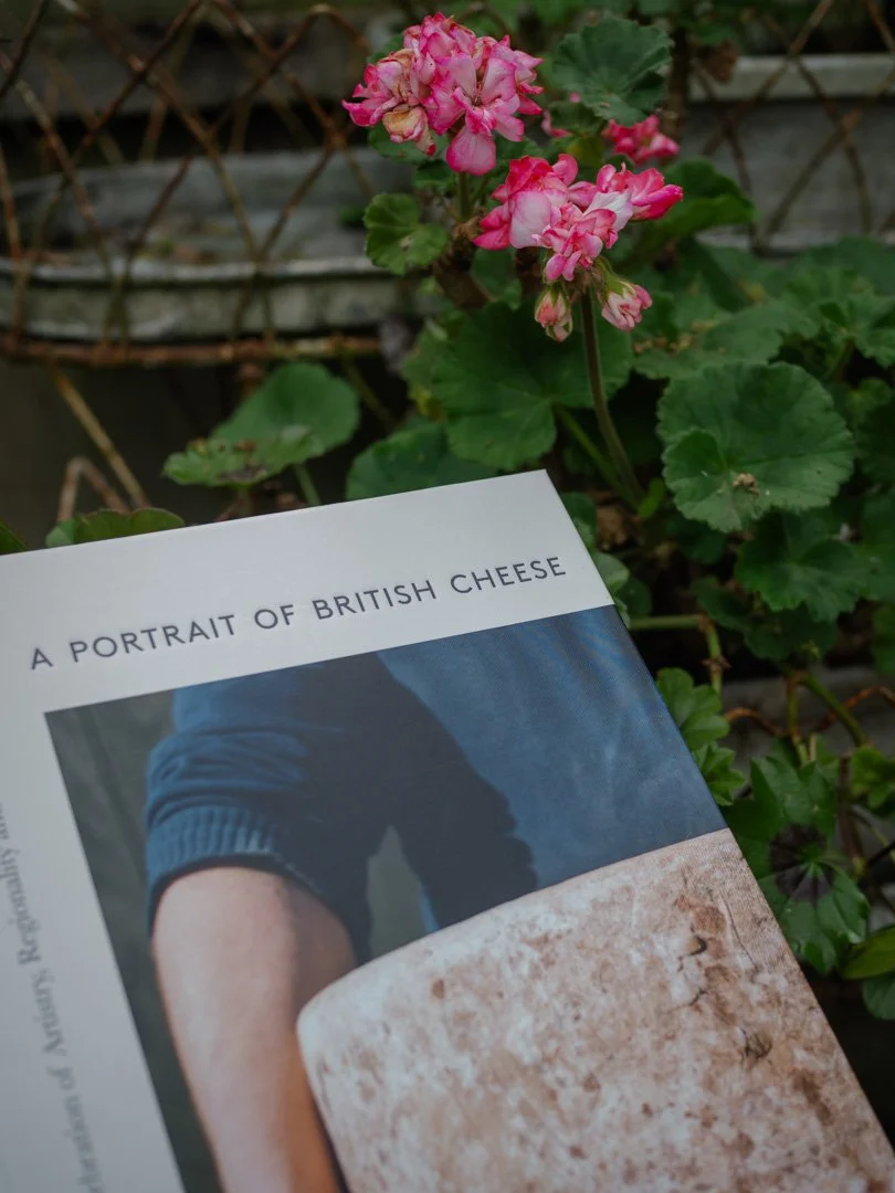 Angus Birditt’s book A Portrait of British Cheese, exploring artisan cheese, rural traditions, and British food culture.