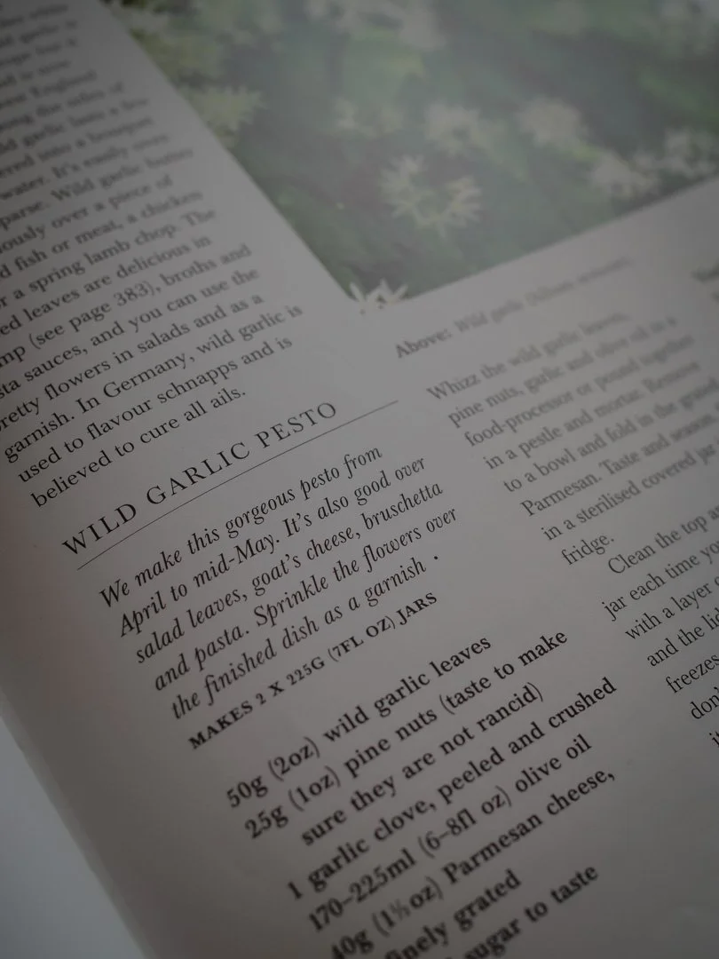 Recipe for wild garlic pesto from a seasonal cookbook, using fresh foraged ingredients