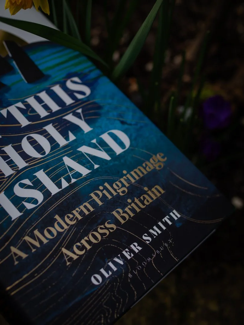 Close-up of the subtitle “A Modern Pilgrimage Across Britain” on the cover of On This Holy Island by Oliver Smith