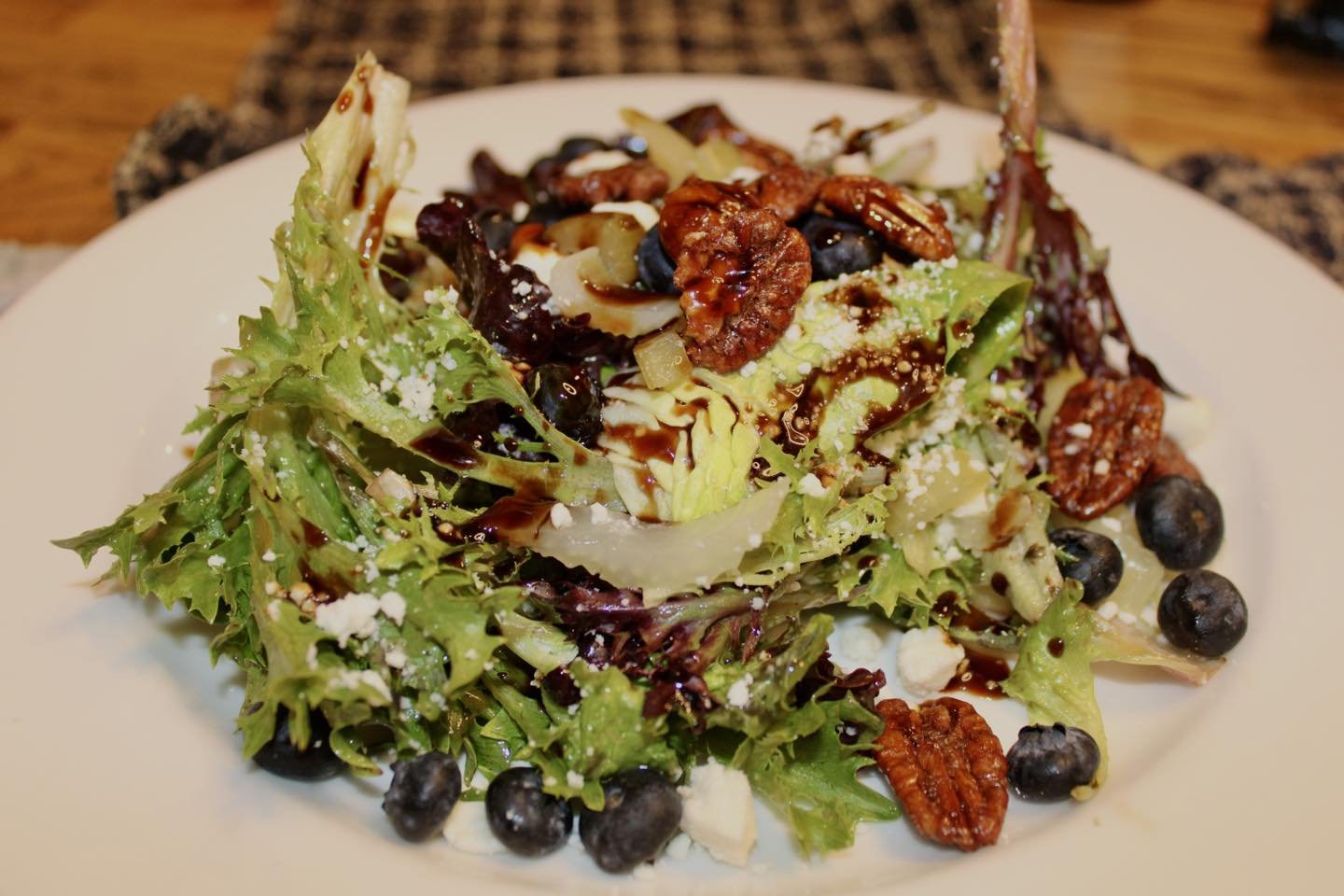 Our Masonic House salad made with Blueberry, pickled celery, feta, candied pecans, savory granola with Texas Olive Co. balsamic drizzle and Dijon-thyme balsamic vinaigrette. Be sure to stop by Harvest and try our updated menu items.