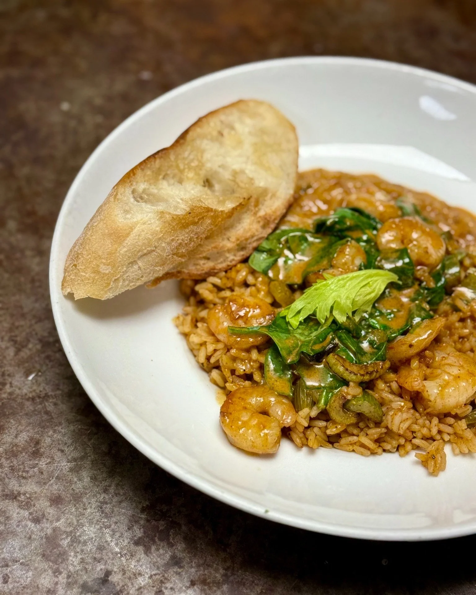 Creole Flavor in Every Bite 🍤🔥
Pan-seared shrimp served over Carolina Gold dirty rice with pork-jalape&ntilde;o sausage, spinach, celery, and Creole butter sauce, and served with a fresh baguette for the perfect finish.

Reservations can be made by
