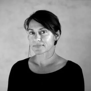 Black and white portrait of photographer, Andrea Bruce.