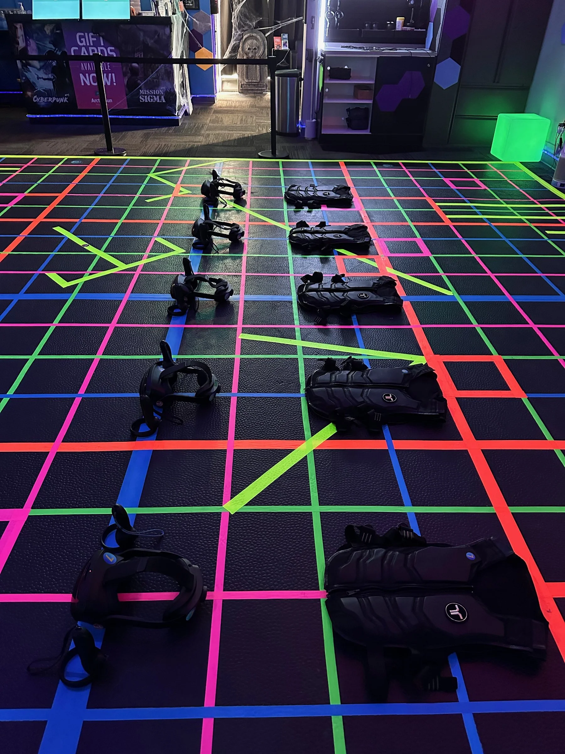 Vests and headsets ready on the arena grid, 2025