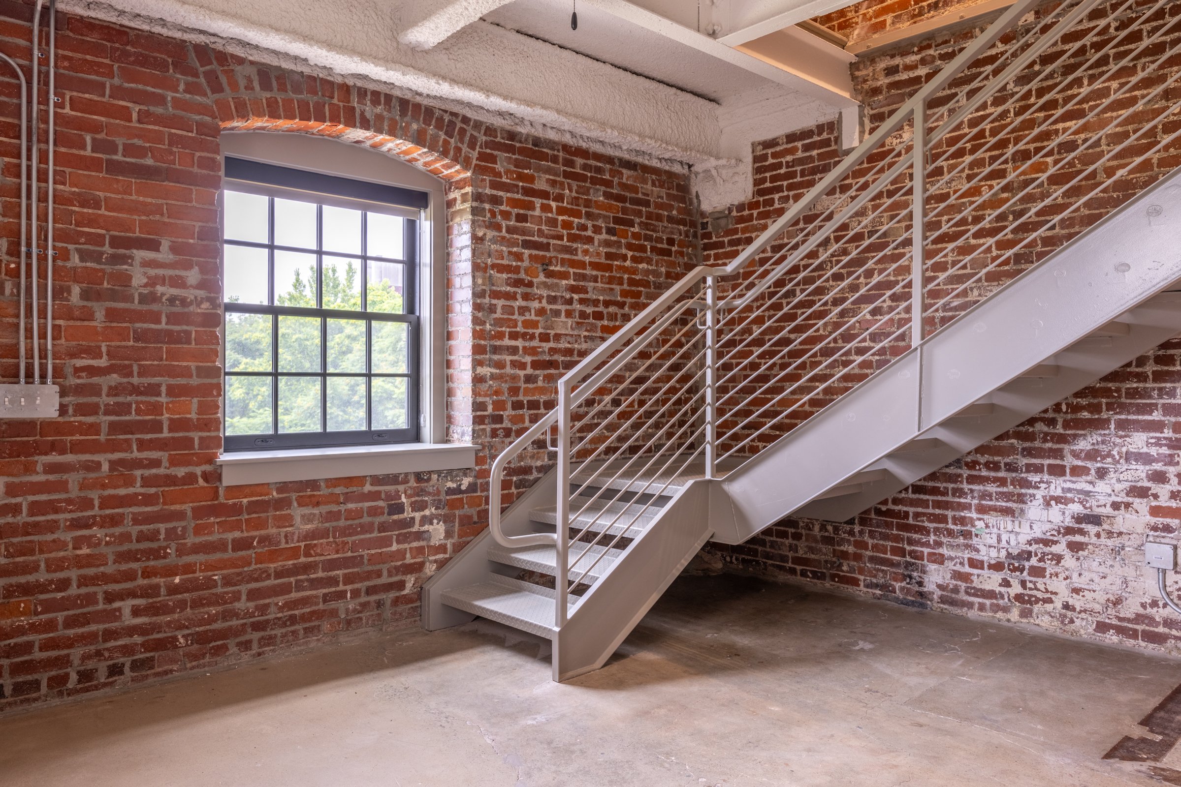 stairwell in loft malthouse apartments with brick walls