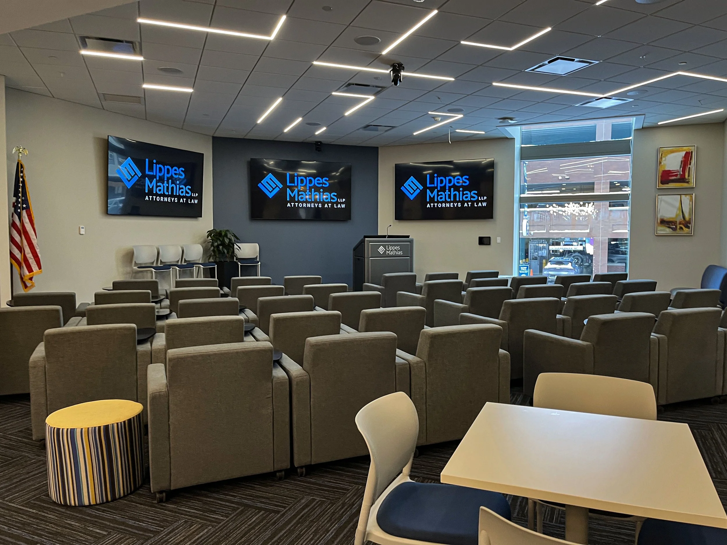 Lippes Mathias office with podium and many arm chairs