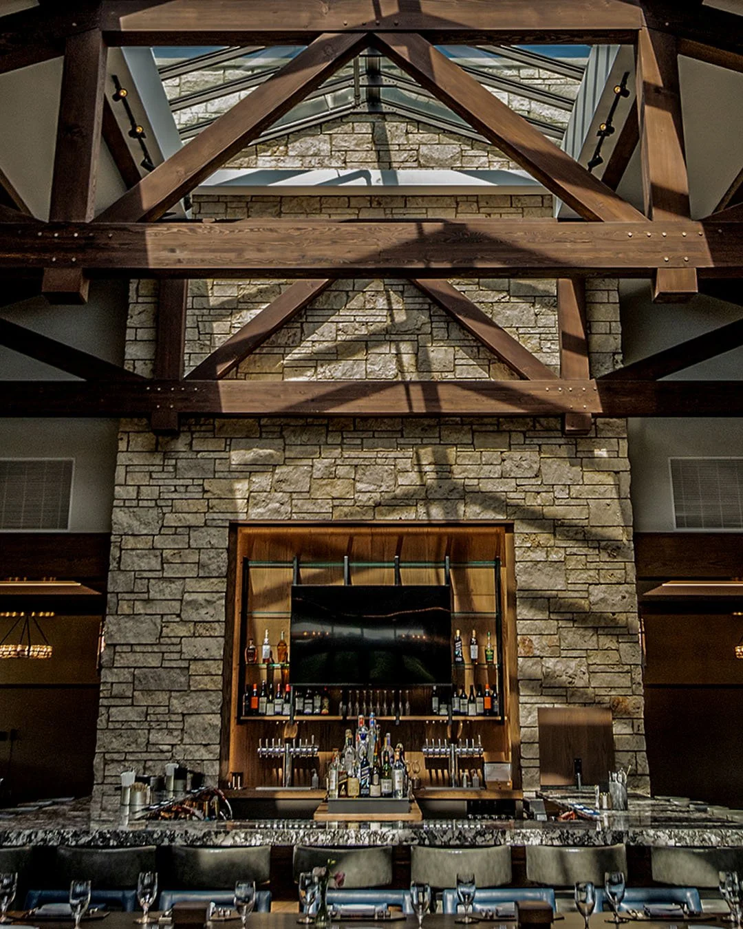 bar with skylight and stone wall
