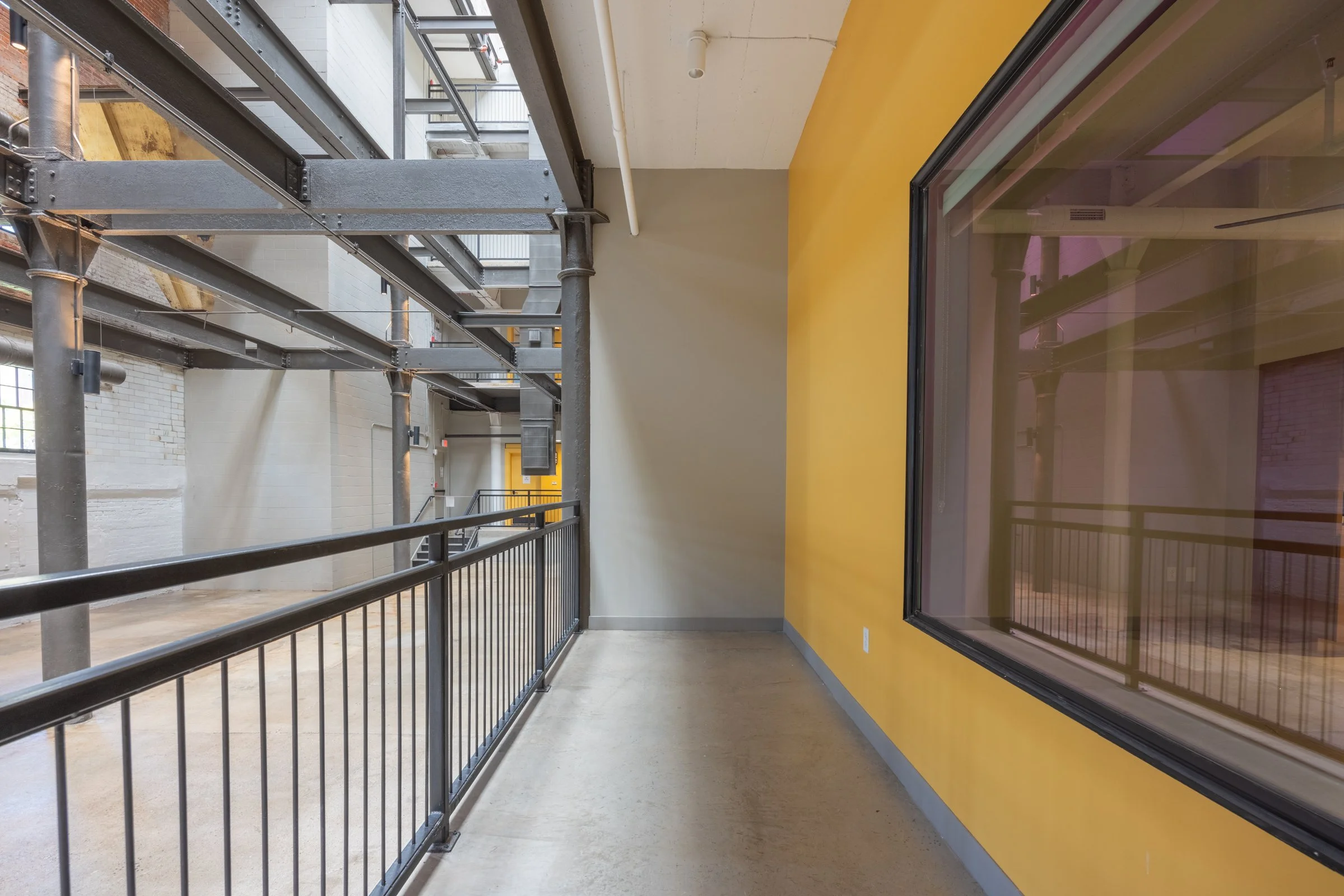 Balcony in American Lofts Projects overlooking silo atrium