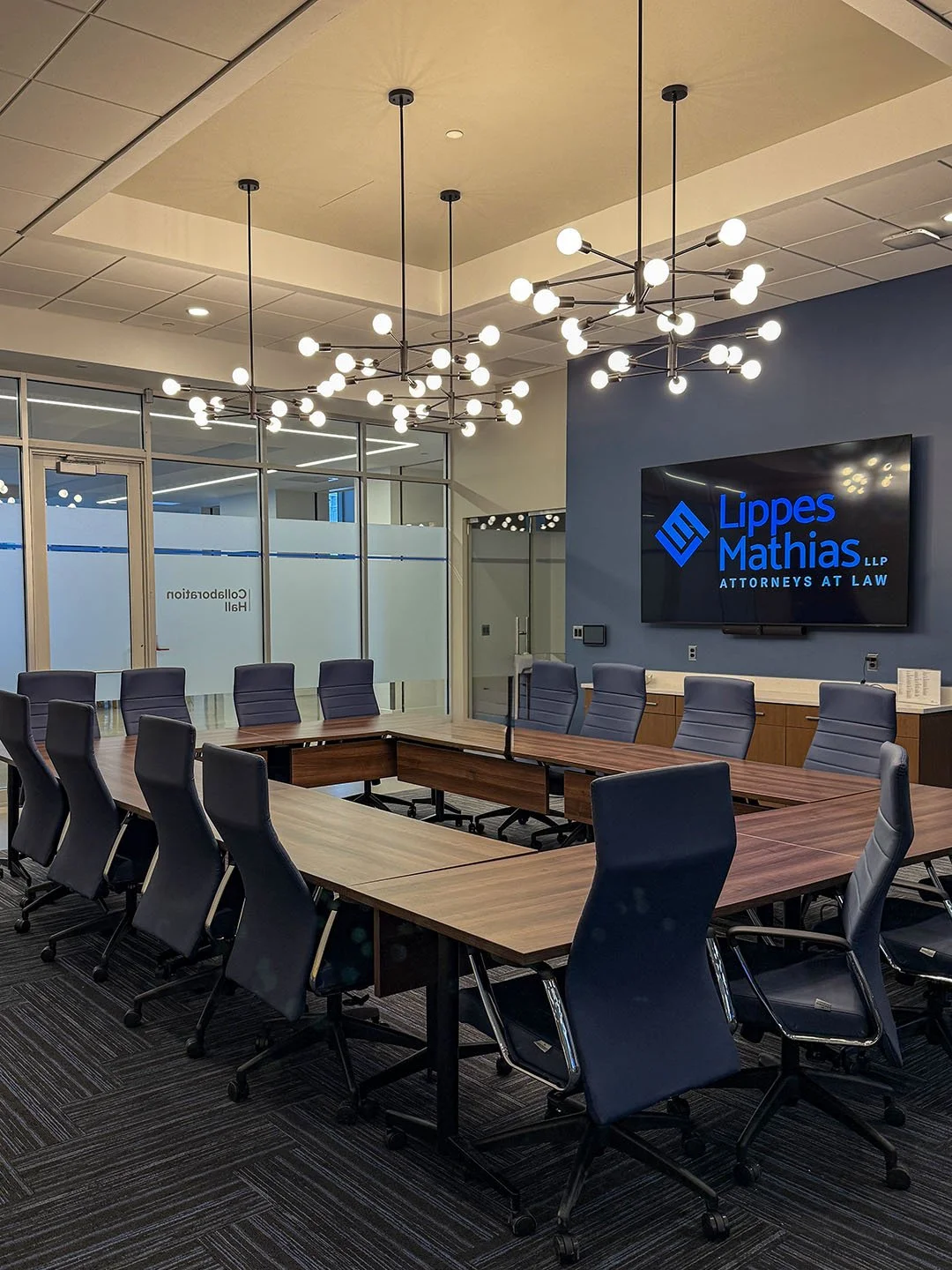 Lippes Mathias conference room with overhead light fixtures and a large conference table