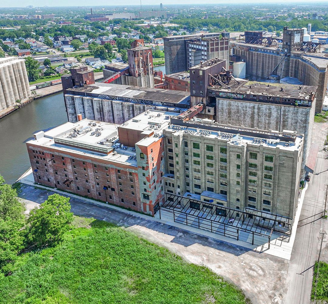 Drone shot of American Lofts at Silo City with views of Larkinville and silos in the background