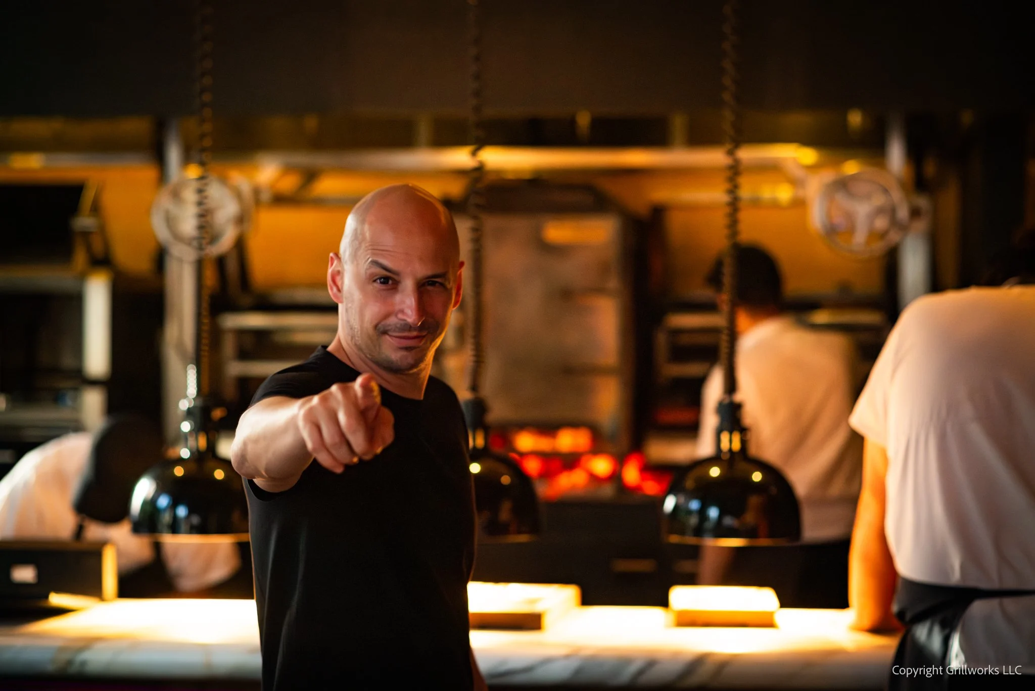 Pablo Rivero in front of Graciela NYC's Grillworks hearth