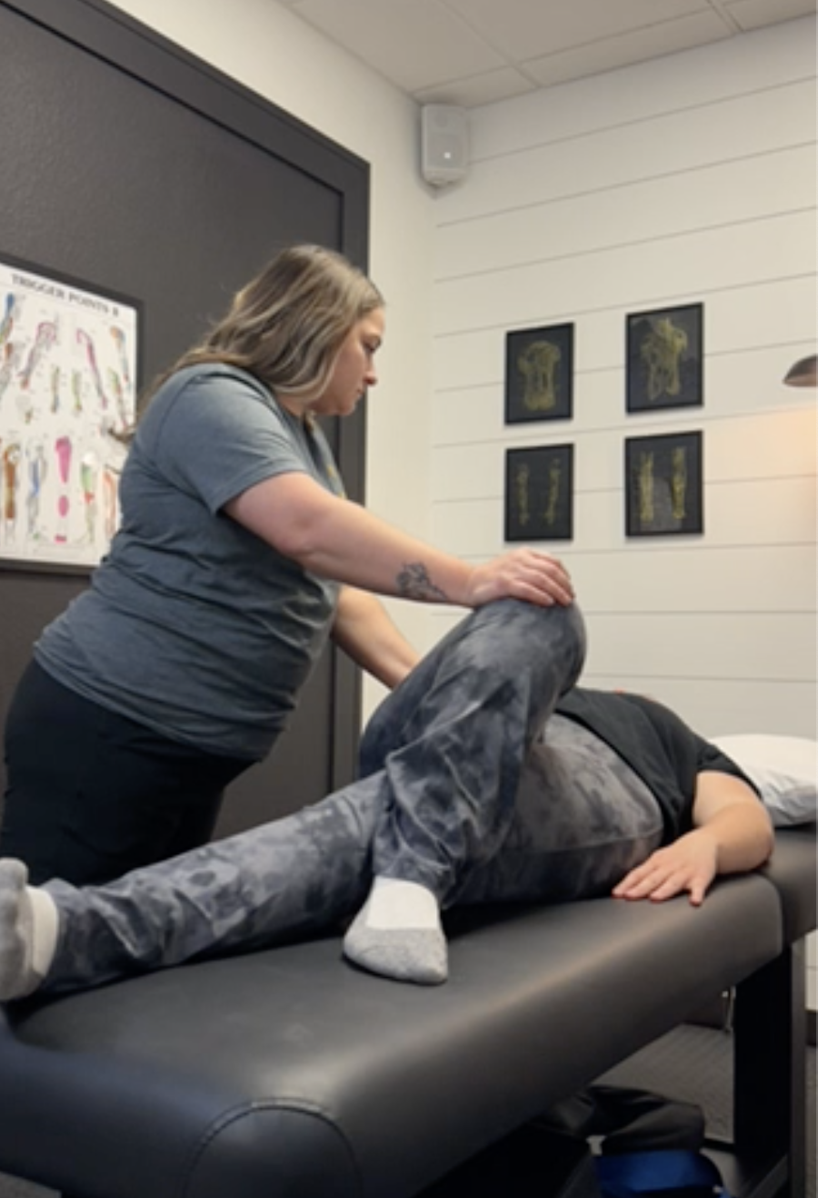 Patient receiving one-on-one manual therapy from a physical therapist at an orthopedic physical therapy clinic in Menasha, WI