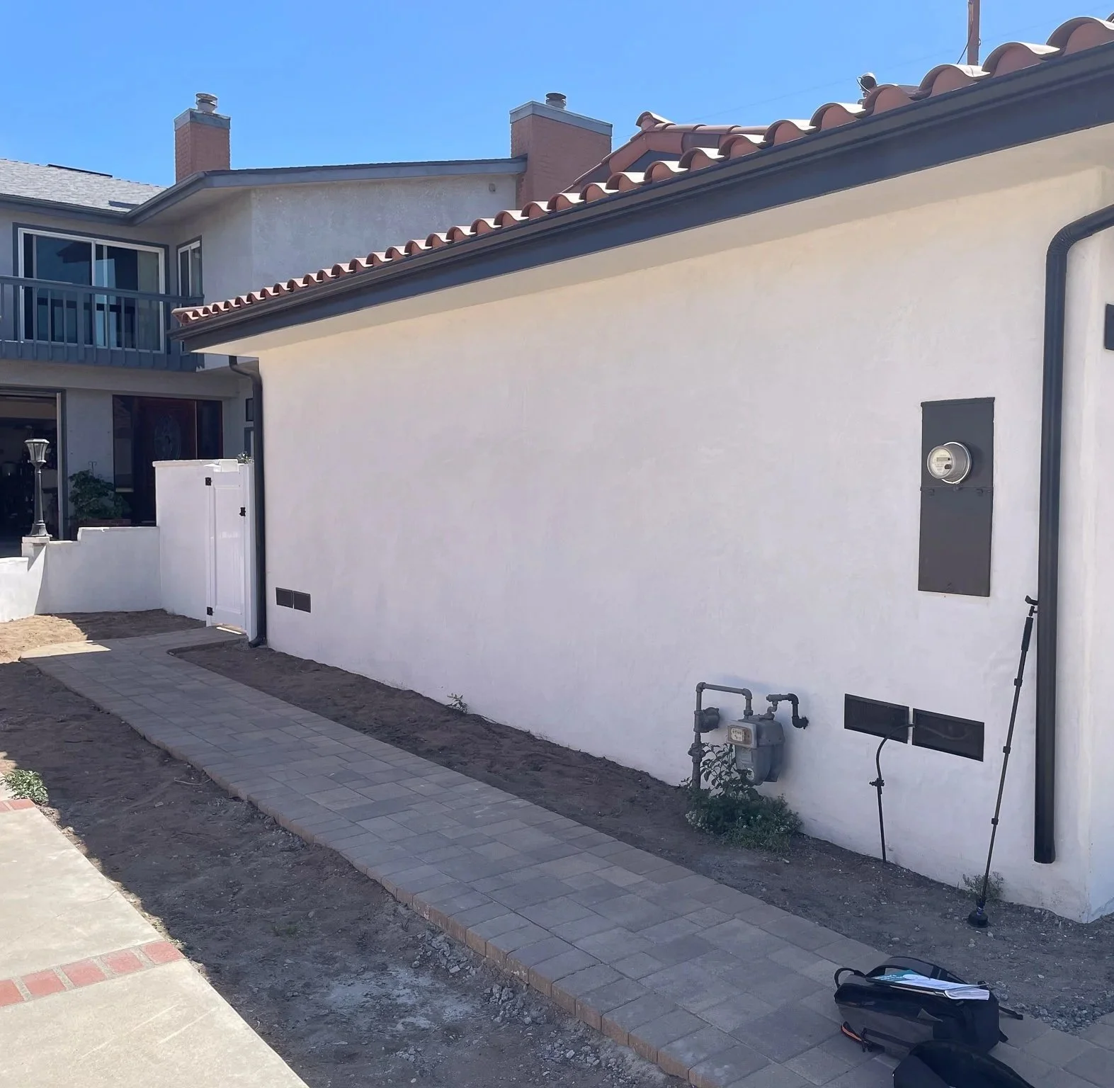 Before Planting: A very dull, uninspiring, ugly strip of land on either side of a paver walkway was our starting point.