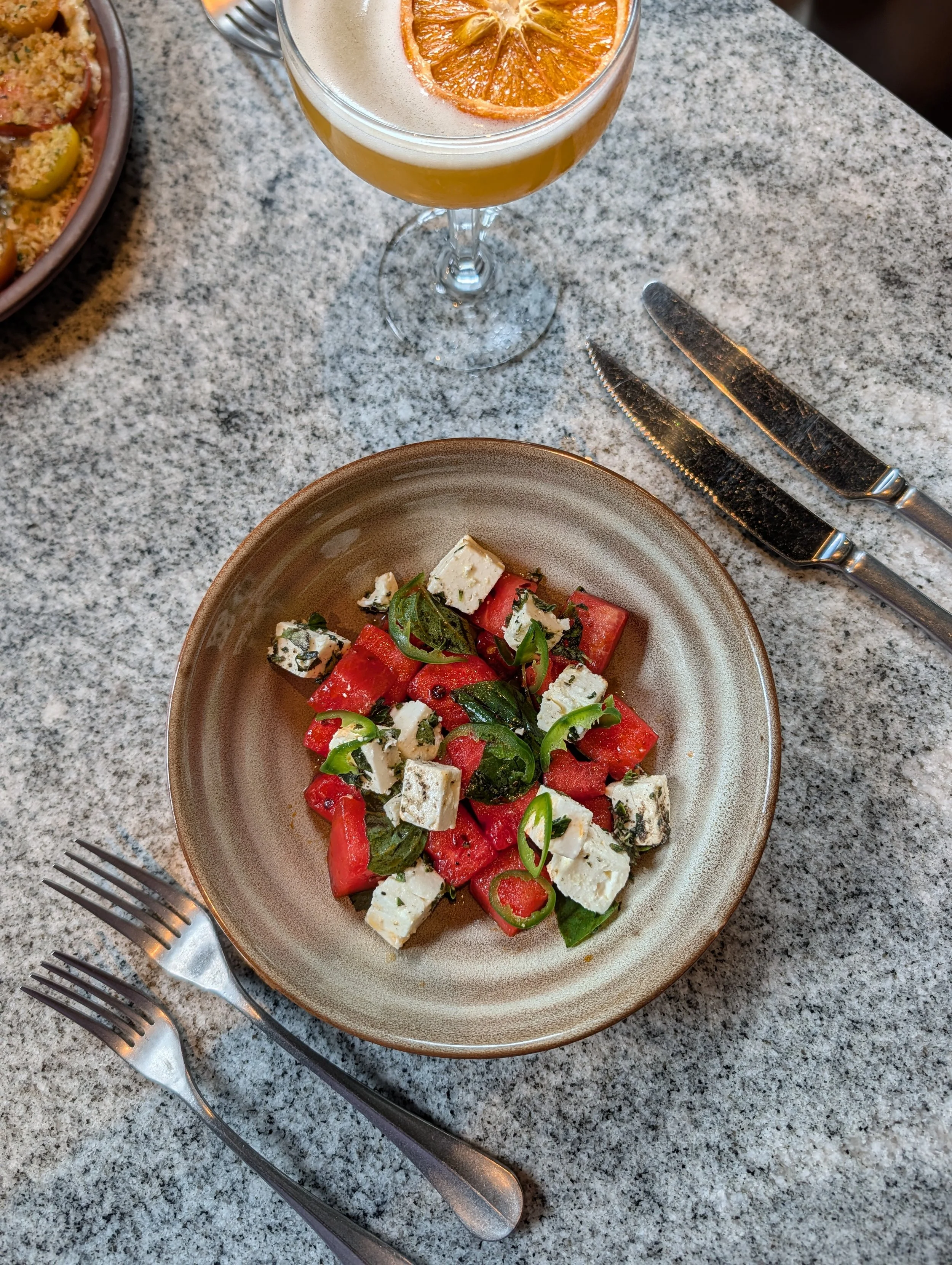 watermelon salad plated on a table