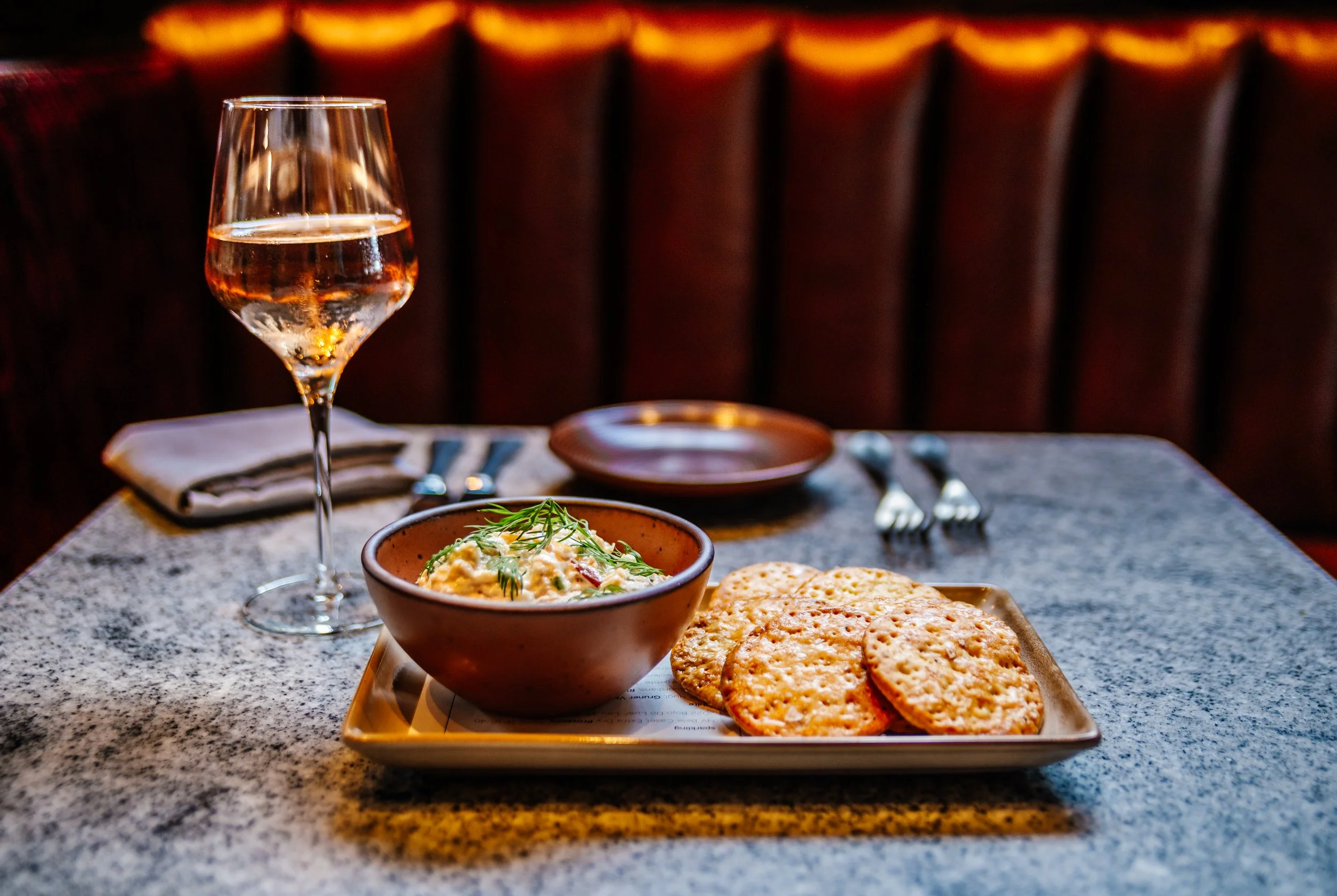 trout dip and crackers with wine