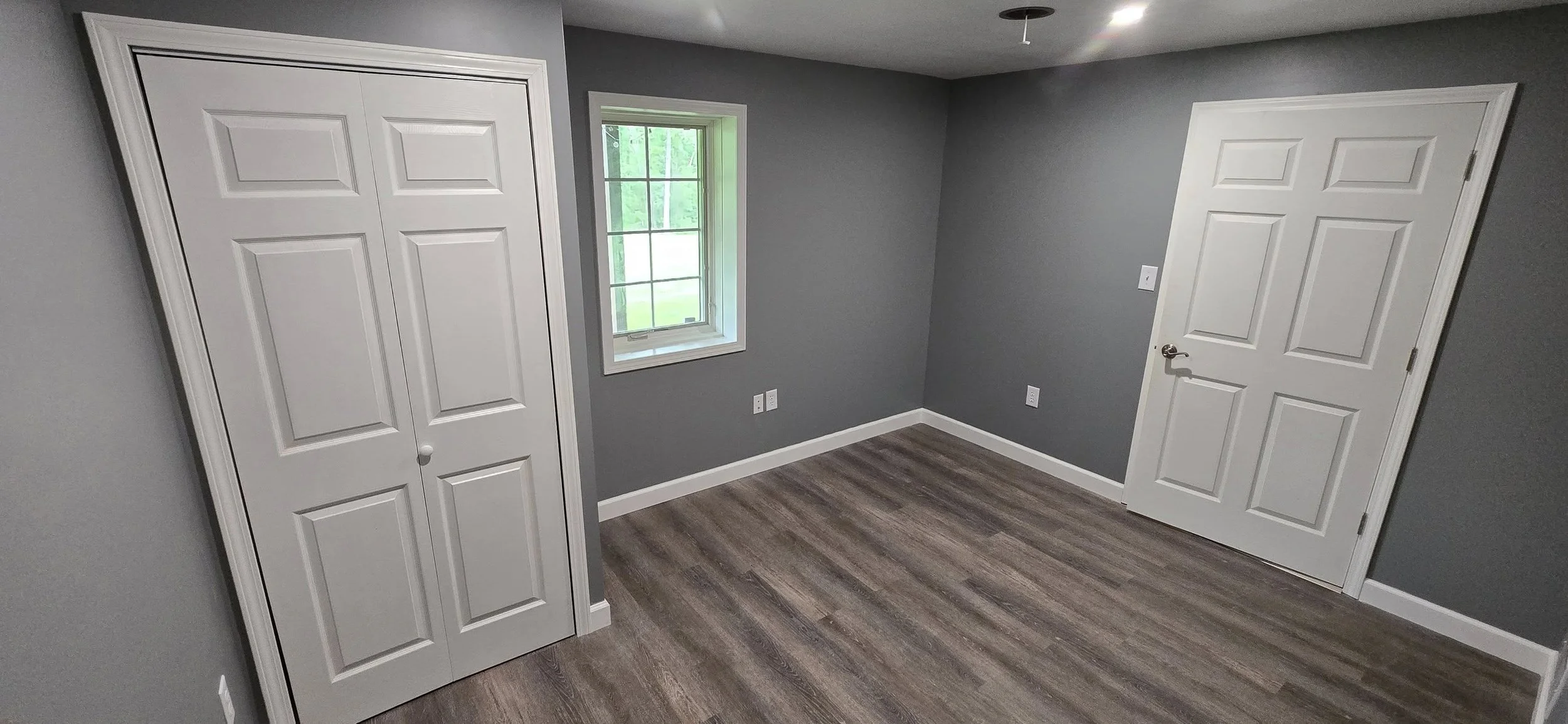 An HVAC system installed in a basement, including ductwork, pipes, and a furnace.