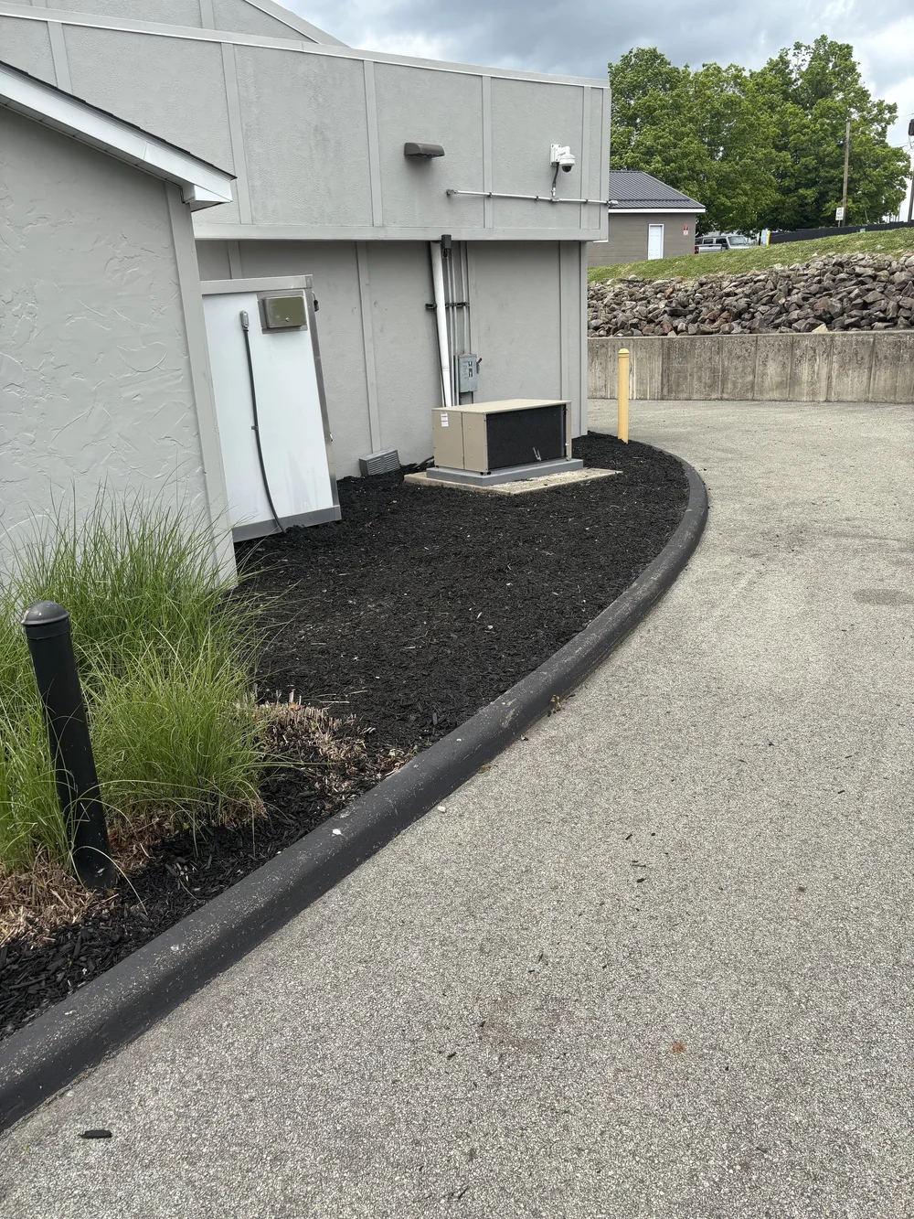 Fresh mulch along a commercial building