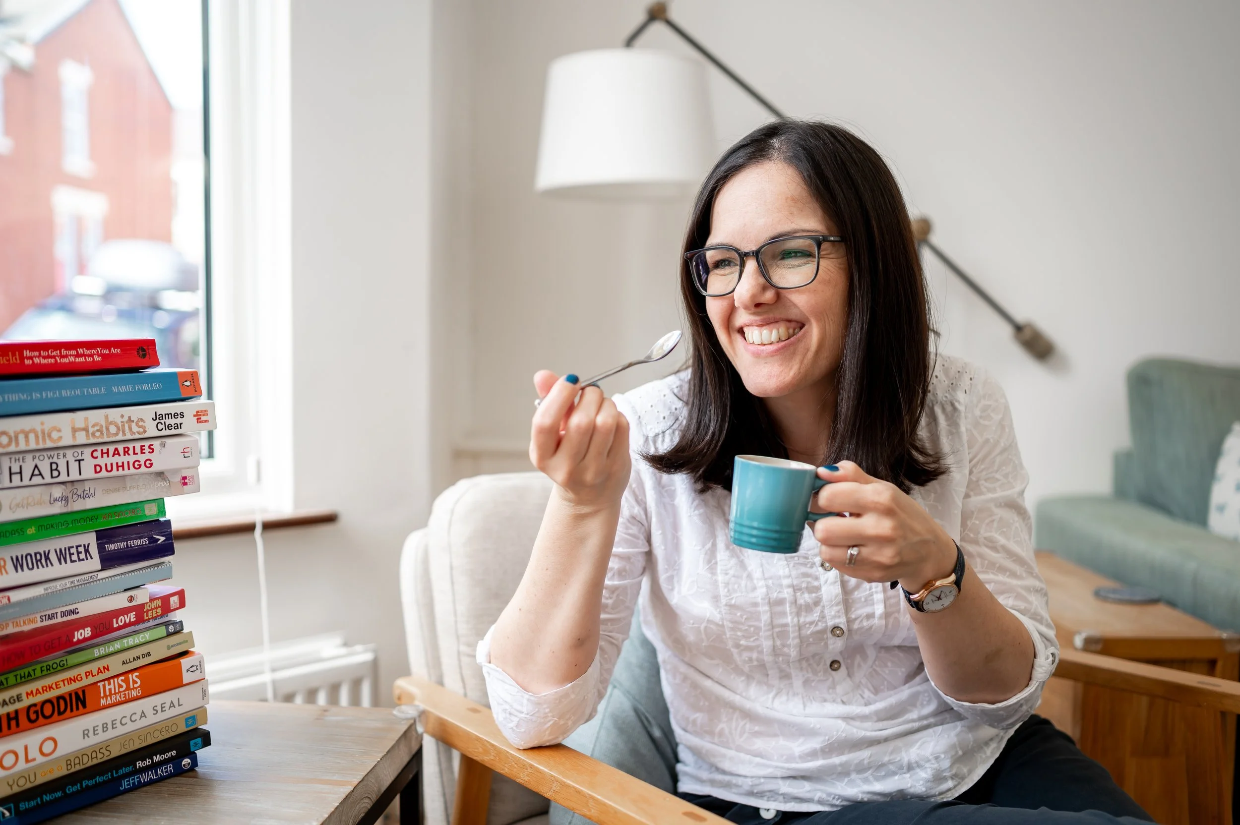 Woman smiling with cup of coffee