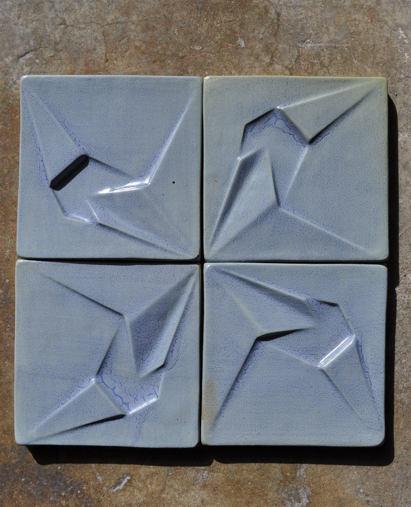 fractured earth tiles are designed by literally folding the surface of the material - inspired by origami and the folds created by tesellating geometries in the universe. ⁠
⁠
in physics, folds are not decorative but rather structural.  gravity itself