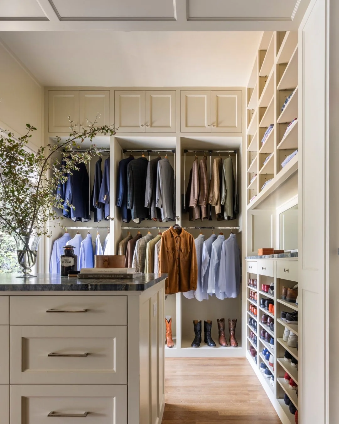 More from our 1912 Heights bungalow: this handsome closet, designed to make the most of every inch. Floor-to-ceiling storage, a generous center island, and plenty of room for a very good shoe collection.

Photography by @juliesoefer 
Styling by @jbhe