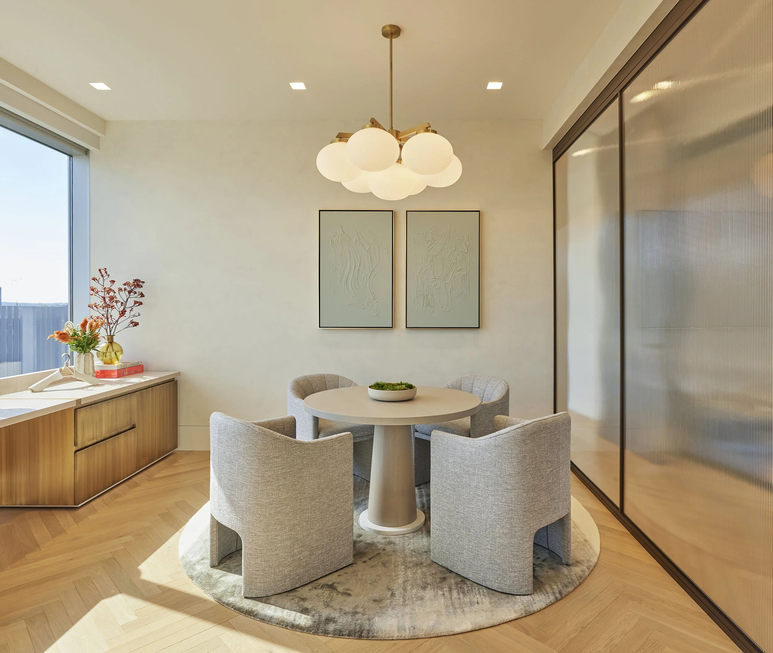 Feminine private office with 4-top meeting table and Tiffany Blue abstract art