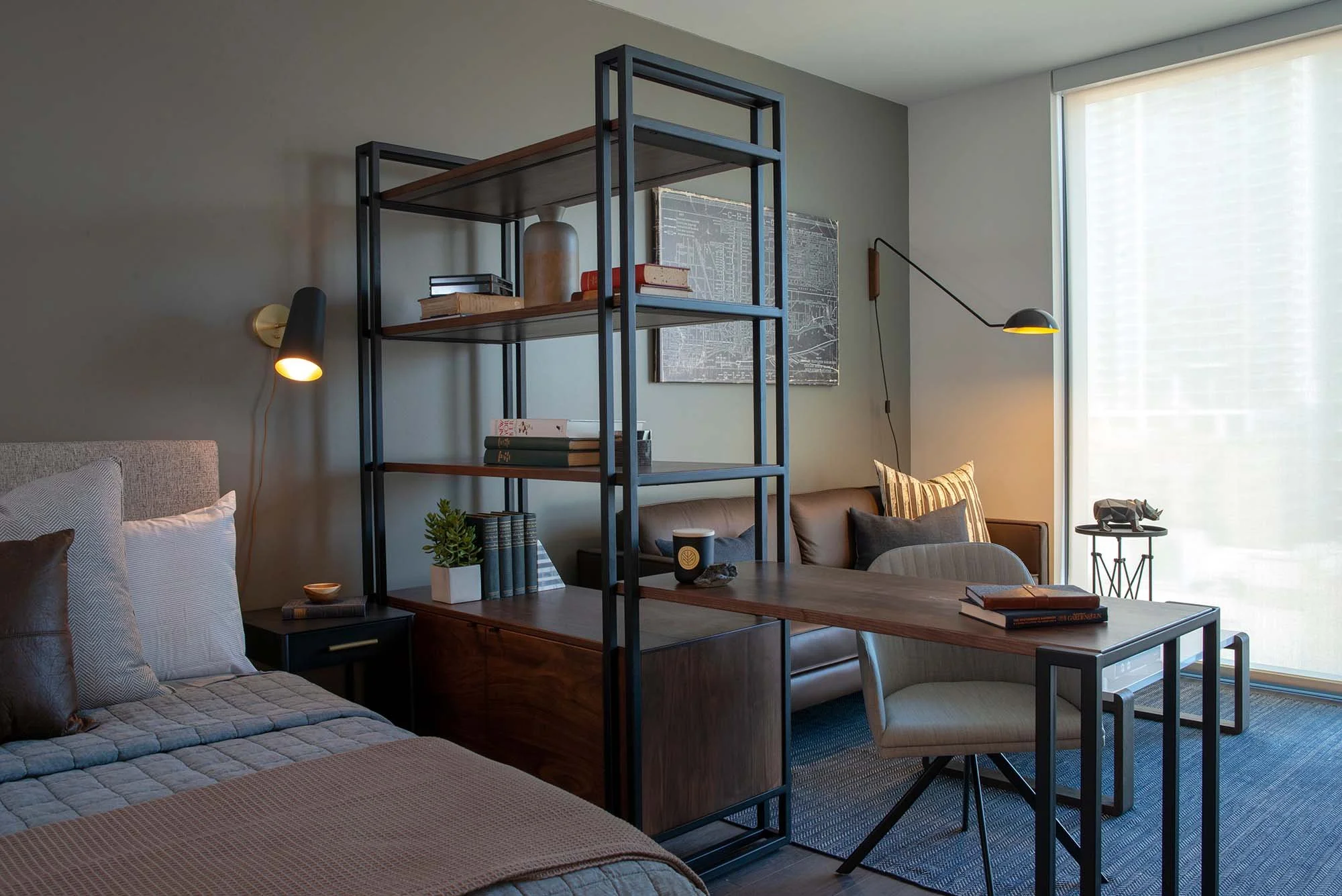 Model studio unit with army green wall and custom room divider