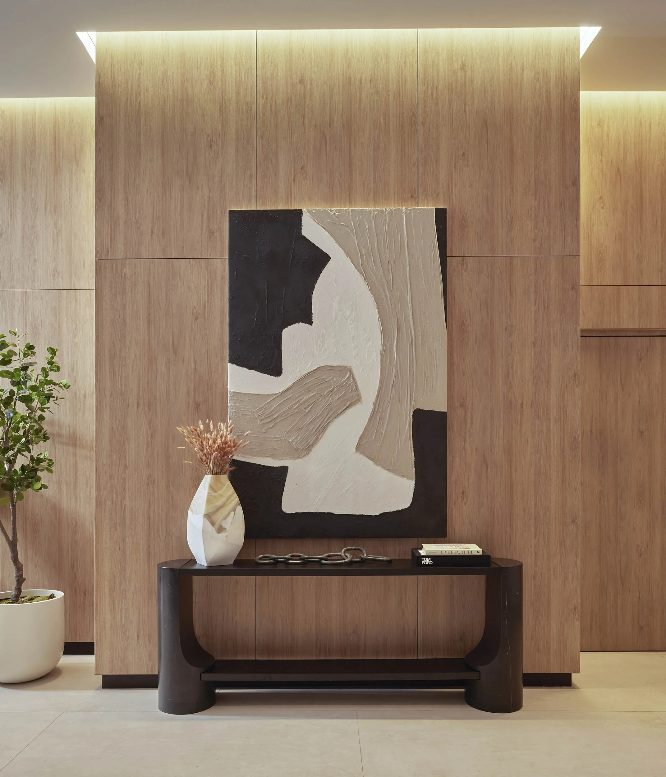 Lobby credenza with focused abstract art moment